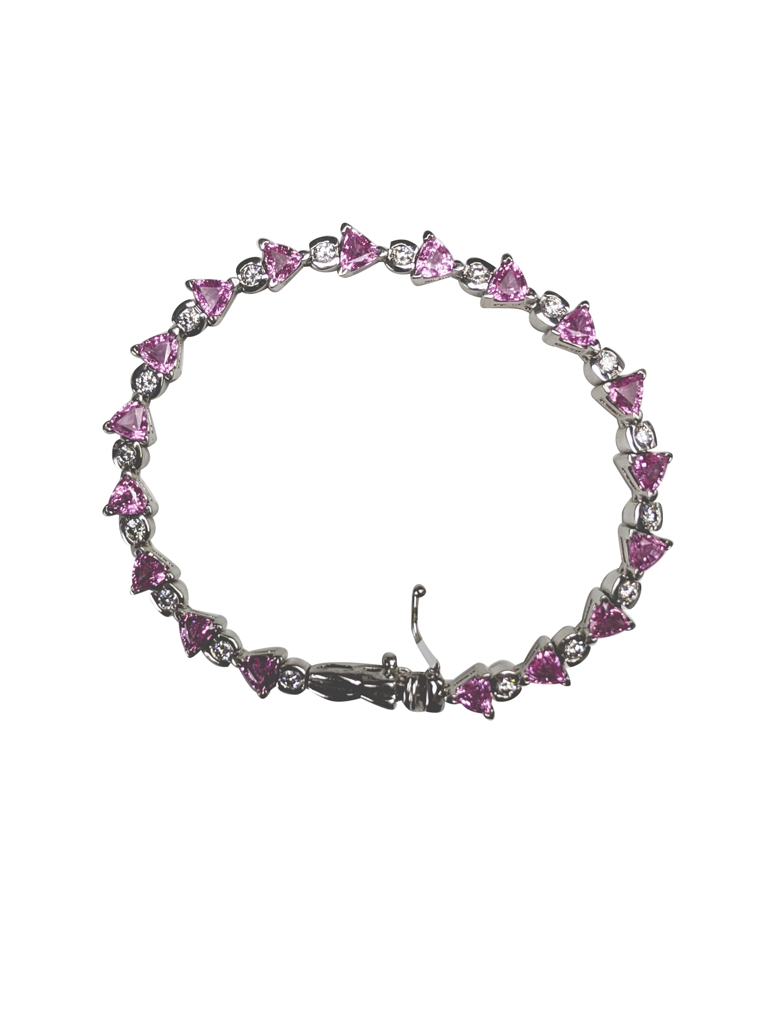 Pink Sapphire Bracelet 14k white Tennis Bracelet, 7 inches long, 18 pink sapphire, 18 diamonds.

1.10 carrot diamond

7.30 carrot Sapphire