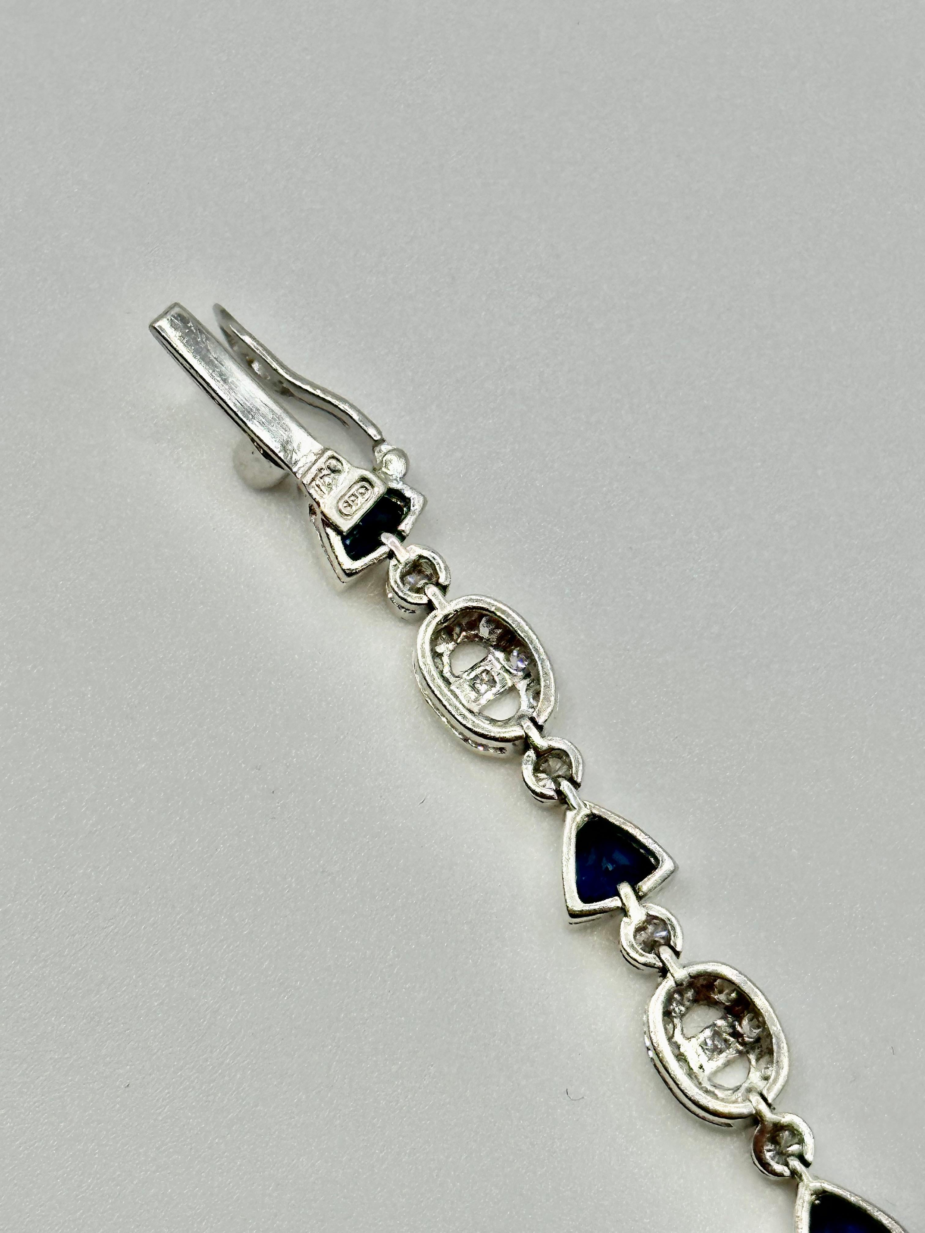 Trillion Cut Trillion Sapphire and Oval Motif Diamond Bracelet on 18 Karat White Gold For Sale