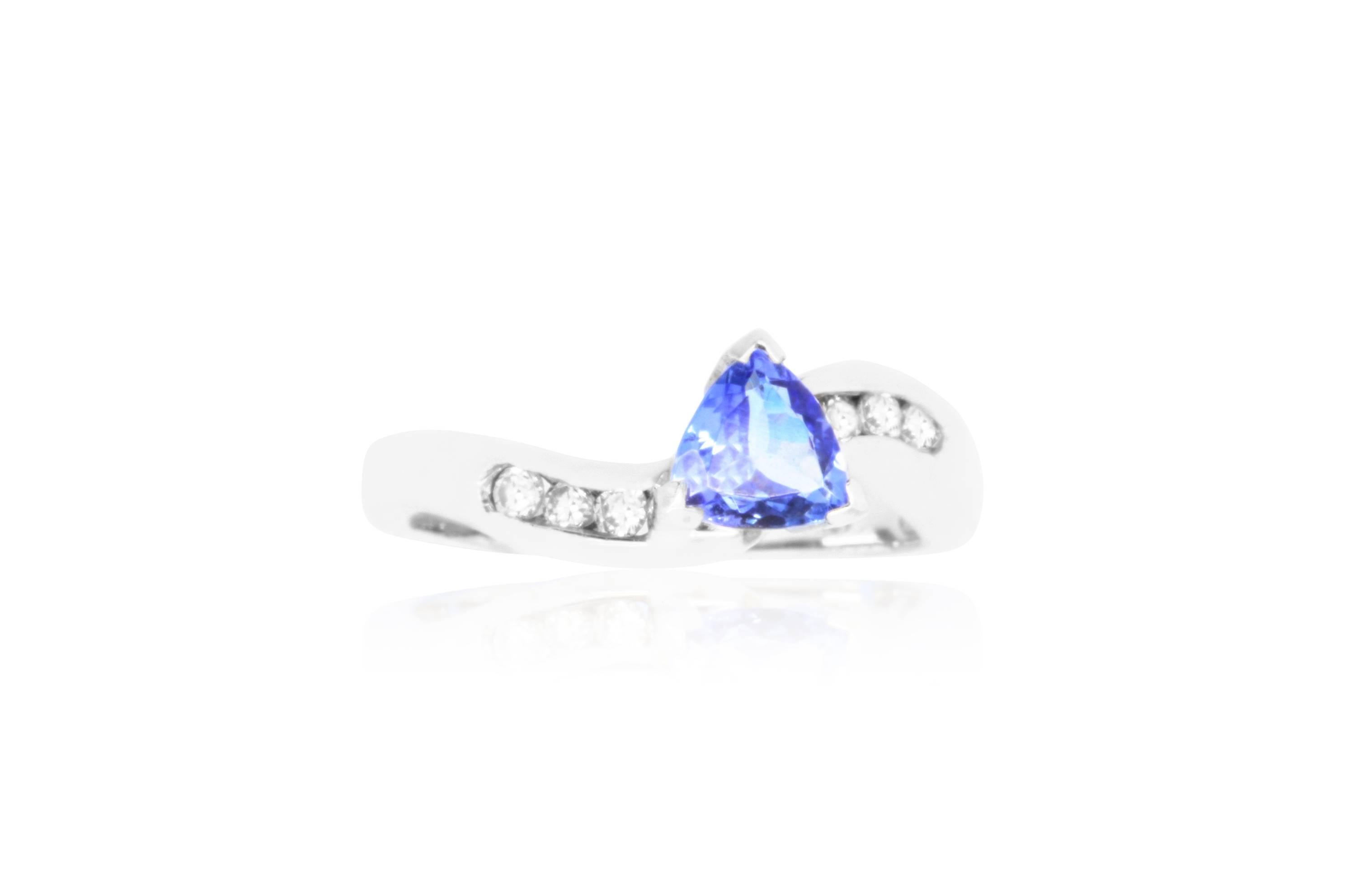 This beautiful Trillion cut Tanzanite will shine as the focal point of this piece. Set in 14k White Gold, the band sparkles with 0.19 carat brilliant round diamonds creating a seriously stunning look.

Material: 14k White Gold
Gemstones: 1 Trillion