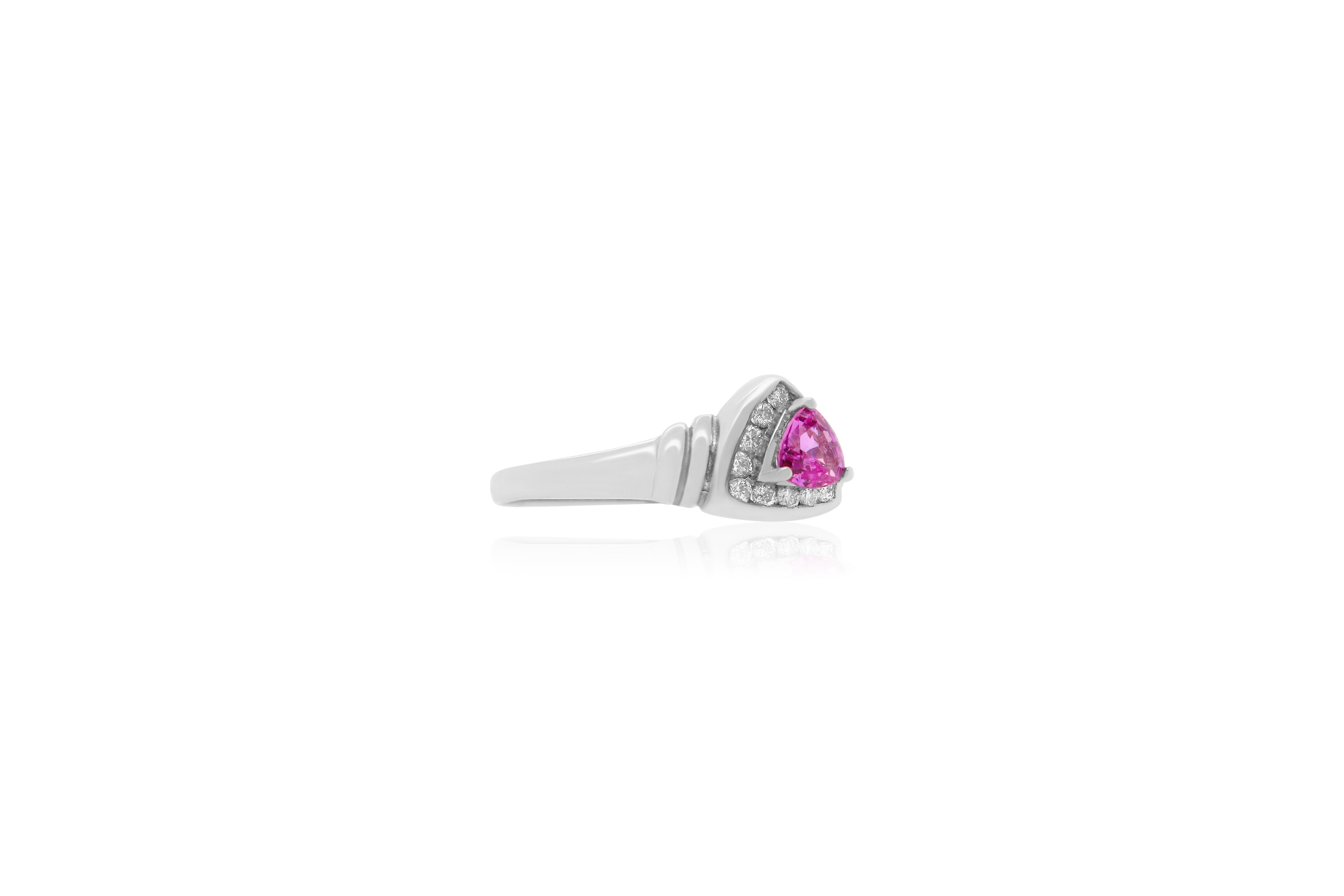 Material: 14k White Gold 
Center Stone Details: 0.48 Carat Pink Sapphire Ring measuring 4.5 mm
Mounting Diamond Details: 12 Brilliant Round White Diamonds at 0.16 Carats - Clarity: SI / Color: H-I
Ring Size: Size 6.5 (can be sized)

Fine