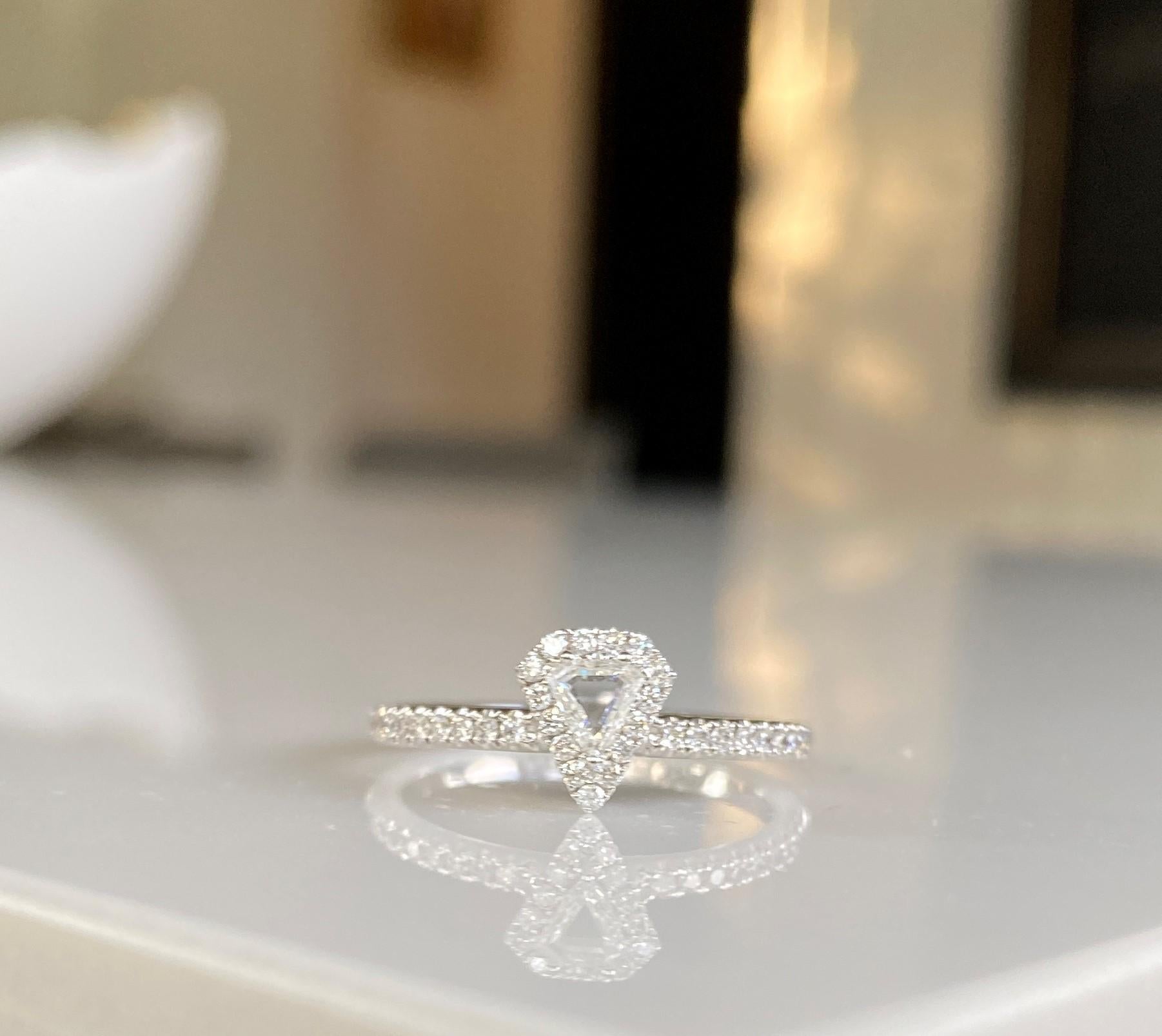 Make a statement with this modern Trillion diamond solitaire and pave diamond ring. Dress up or down, wear it as a fun stacking ring or alternative bridal band or engagement ring.  Total diamond weight - 0.37 ctw set in 18k white gold.