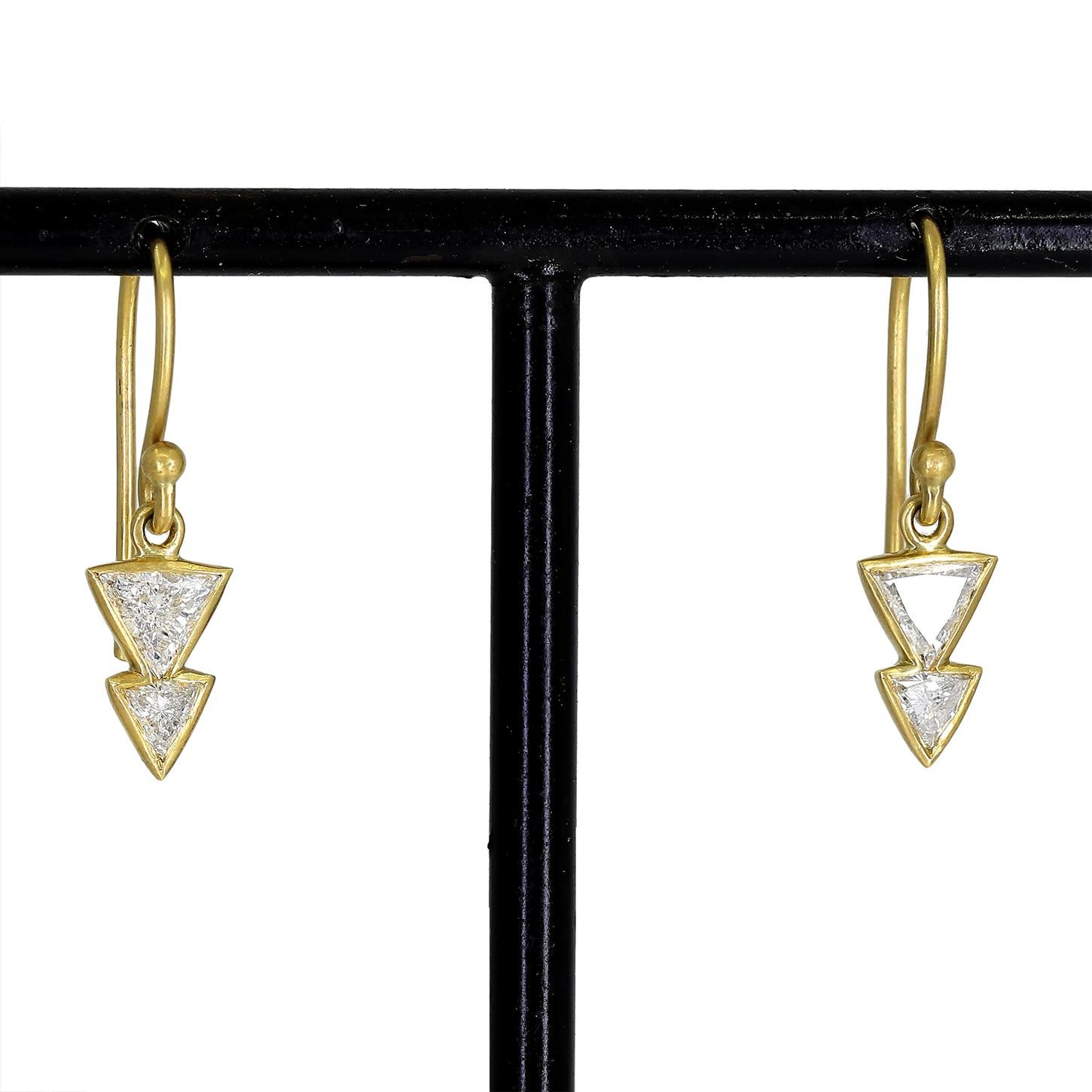 Double dagger drop earrings hand-fabricated by Tej Kothari featuring four shimmering trillion-cut white diamonds totaling 0.46 carats, finished on french ear wires in matte-finished 18k yellow gold.  

About the Designer - Kothari Designs launched
