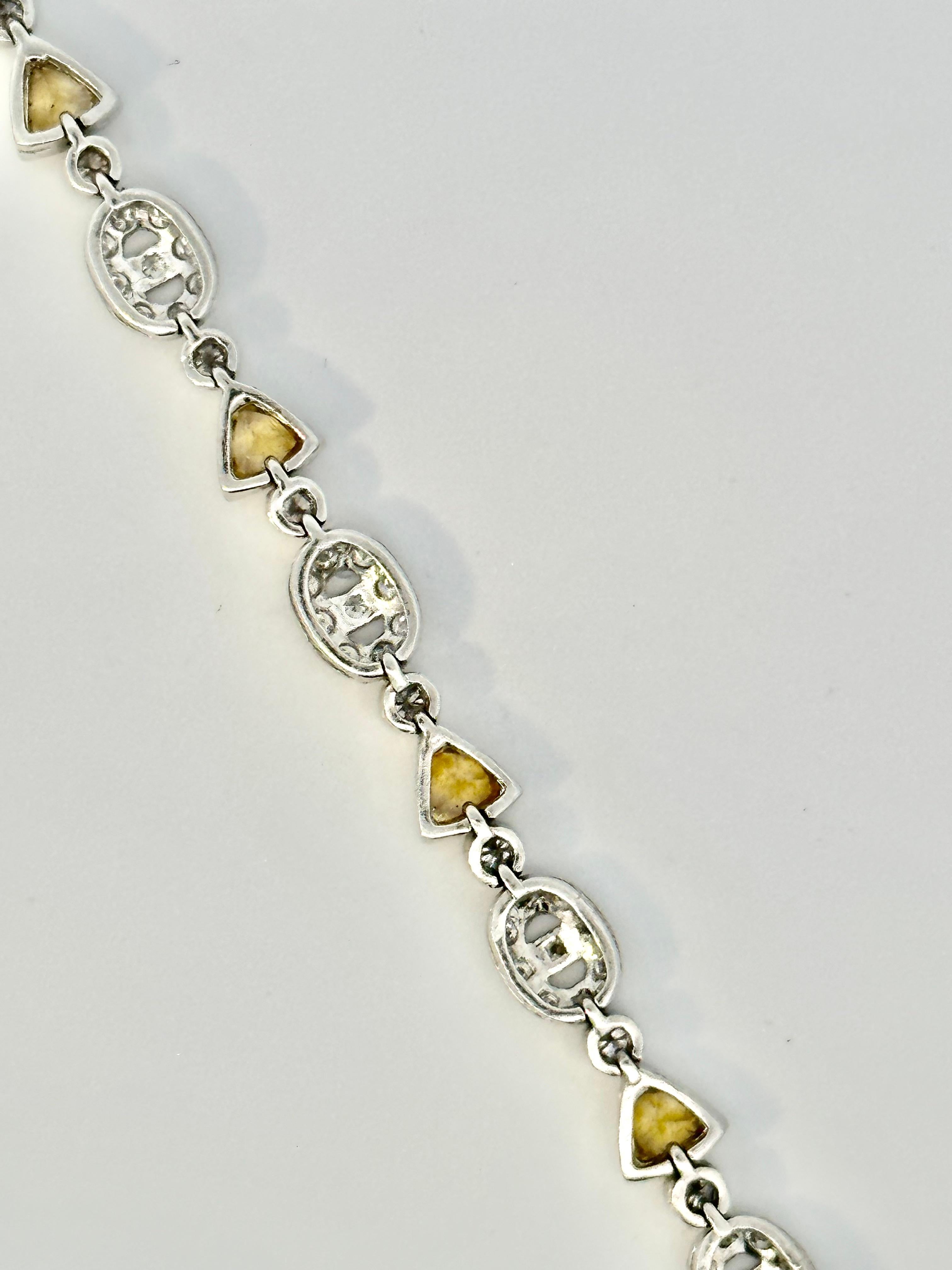 Trillion Cut Trillion Yellow Sapphire and Oval Motif Diamond Bracelet on 18 Karat White Gold For Sale
