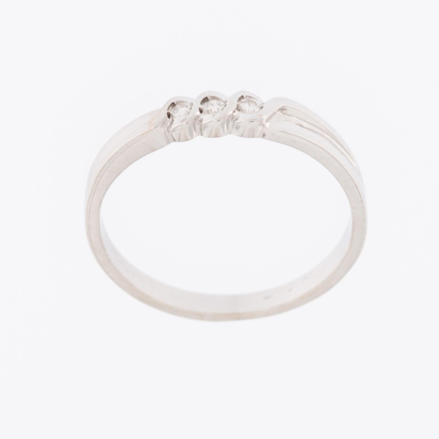 The Trilogy 18kt White Gold Ring with Diamonds is an exquisite and elegant piece of jewelry that exudes sophistication and timeless beauty. Crafted from high-quality 18-karat white gold, this ring showcases a stunning trilogy design, featuring three