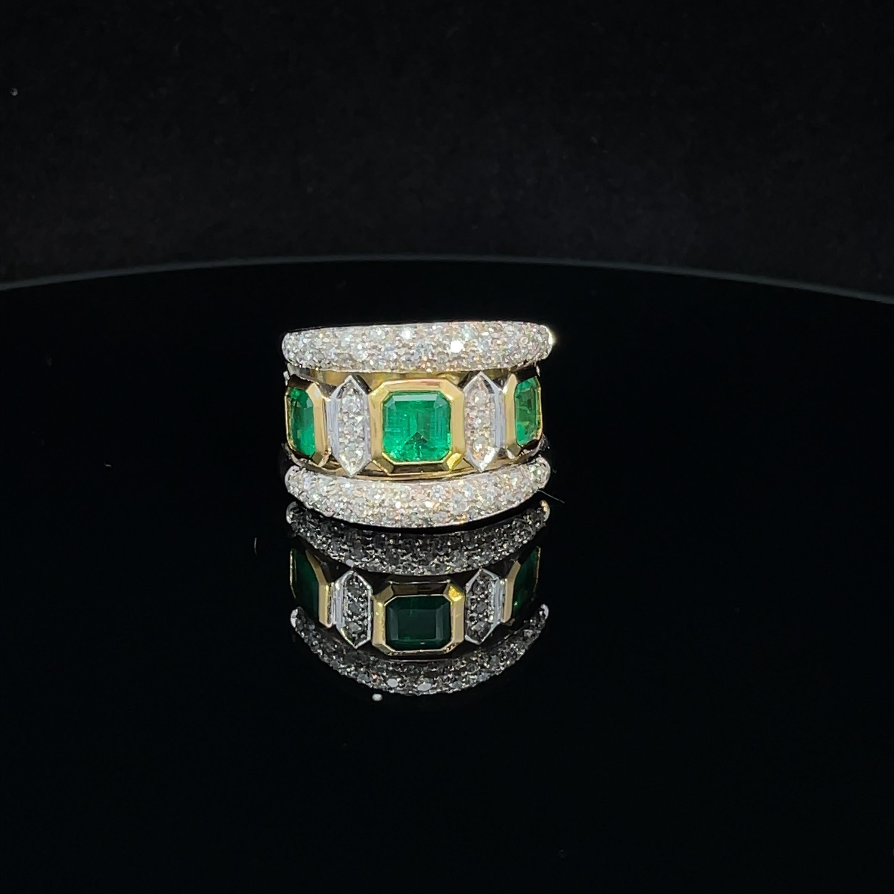 Two-tone 18k gold ring, emeralds and diamonds
a band crossed in the center by three emeralds of beautiful bright green color (Colombia)  rectangular-cut with octagonal outline totaling ct 2.00, brilliant-cut diamond outline totaling ct 1.20