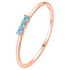 Anello Trilogy con acquamarina rotonda in oro rosa 14K
