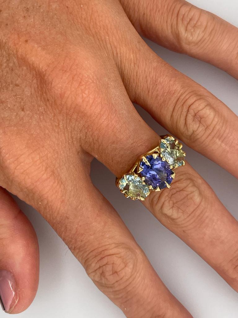 For Sale:  Trilogy Three Stone Blue Tanzanite and Aquamarine Ring in 18ct Yellow Gold 12