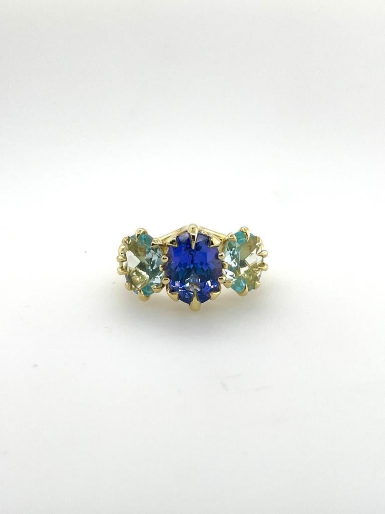 For Sale:  Trilogy Three Stone Blue Tanzanite and Aquamarine Ring in 18ct Yellow Gold 9