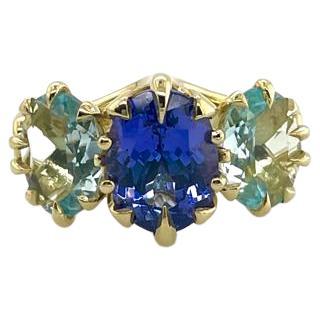 For Sale:  Trilogy Three Stone Blue Tanzanite and Aquamarine Ring in 18ct Yellow Gold