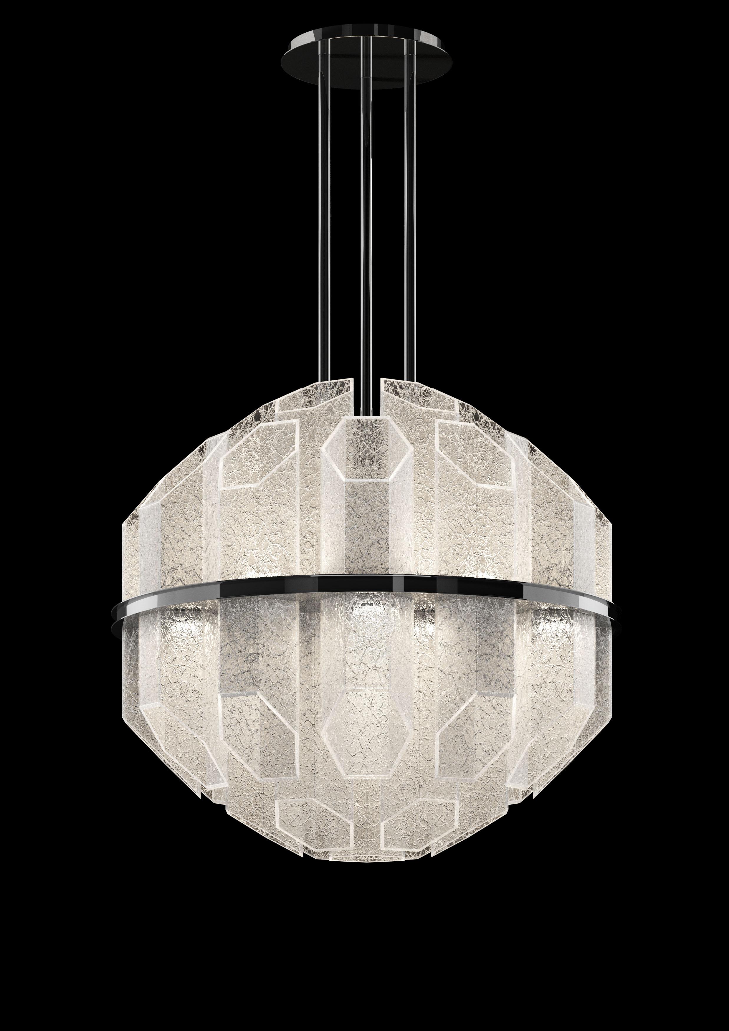 Nous vous présentons ici la lampe à suspension Trim 7322 en verre avec finition en chrome poli. Que se passe-t-il si l'on prend une idée des années soixante, qu'on la compose géométriquement à l'aide de calculs mathématiques précis, puis qu'on