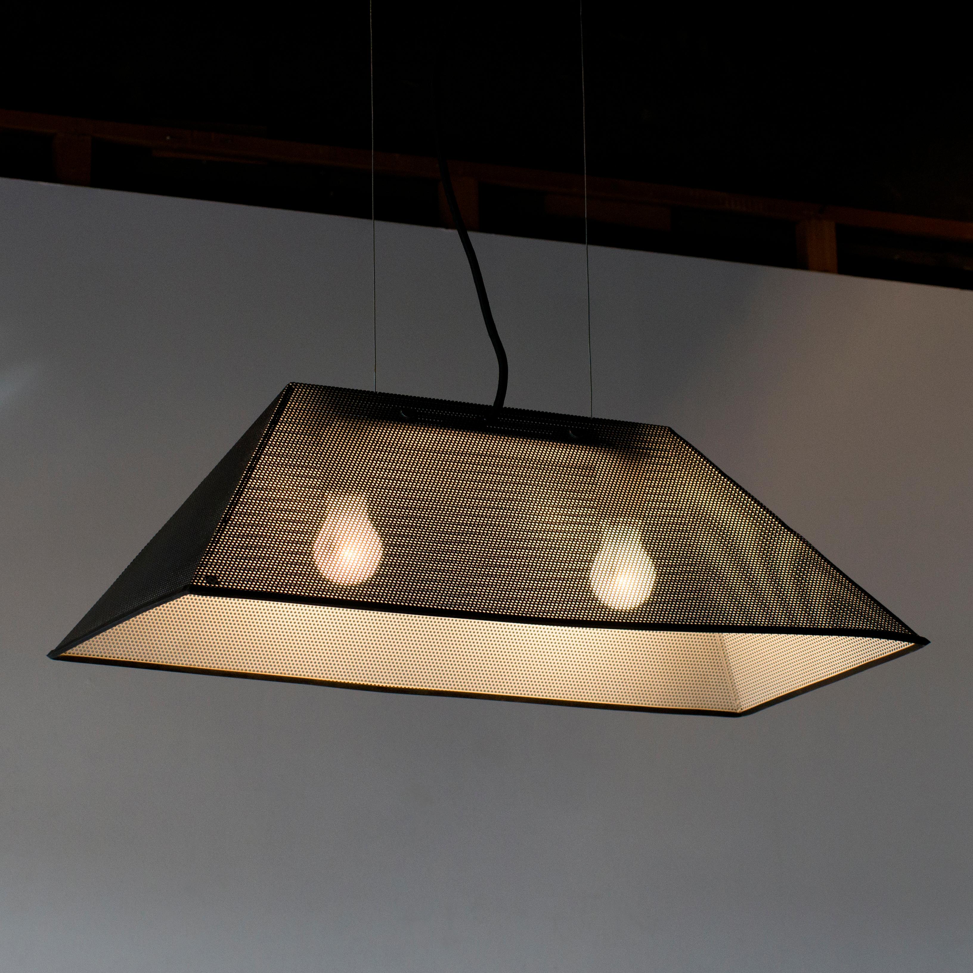 Trimesh pendant lamp designed by Shohei Mihara for Yamagiwa.
Shade is black and two light socket model. Punching metal shade can be able to pass the light beam.