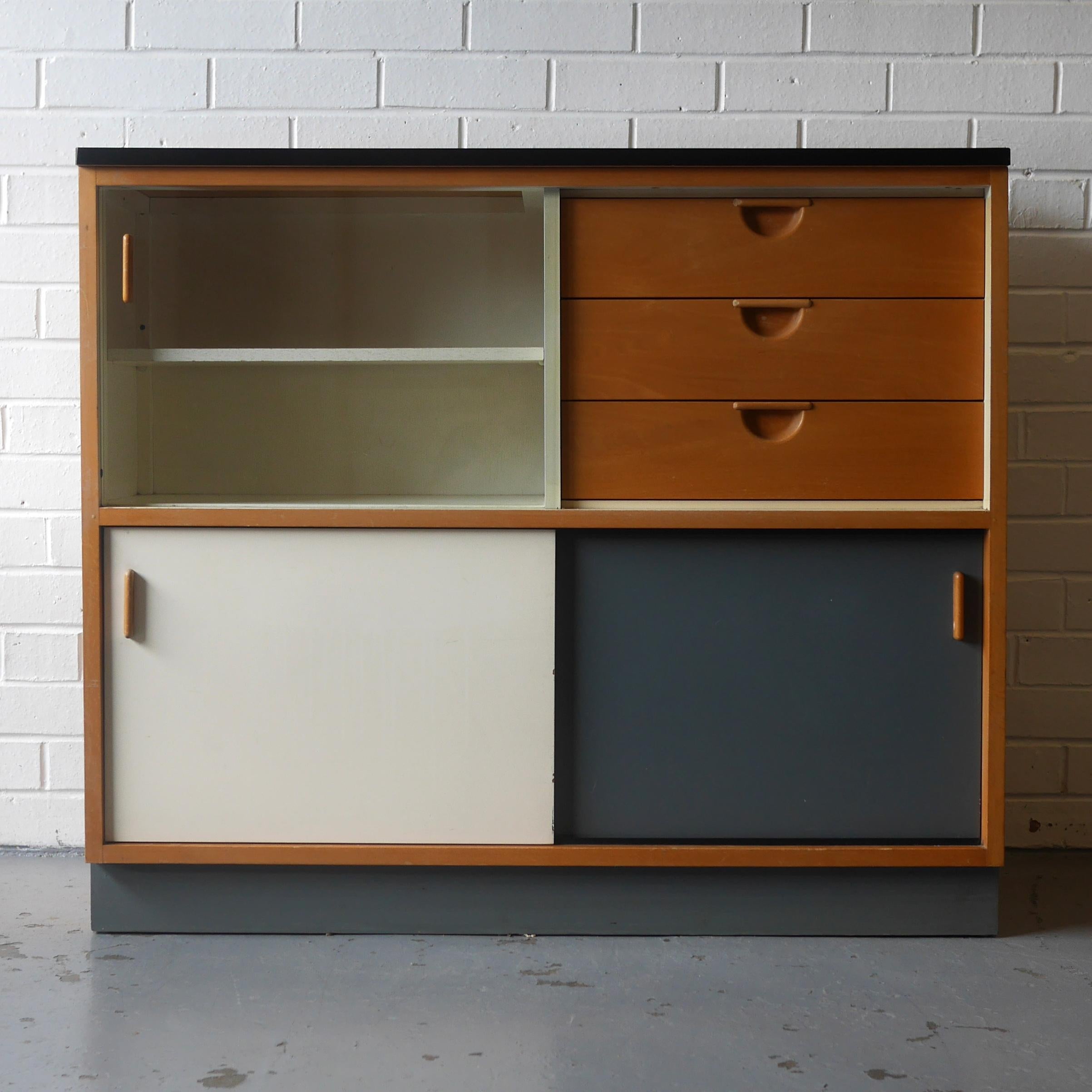 Original Trimma cabinet by Frank Guille for Kandya Ltd, circa 1954. This model 642 cabinet is in wonderful original condition with only light signs of wear and tear and finished in a sought after colour combination of blues, white and slate grey