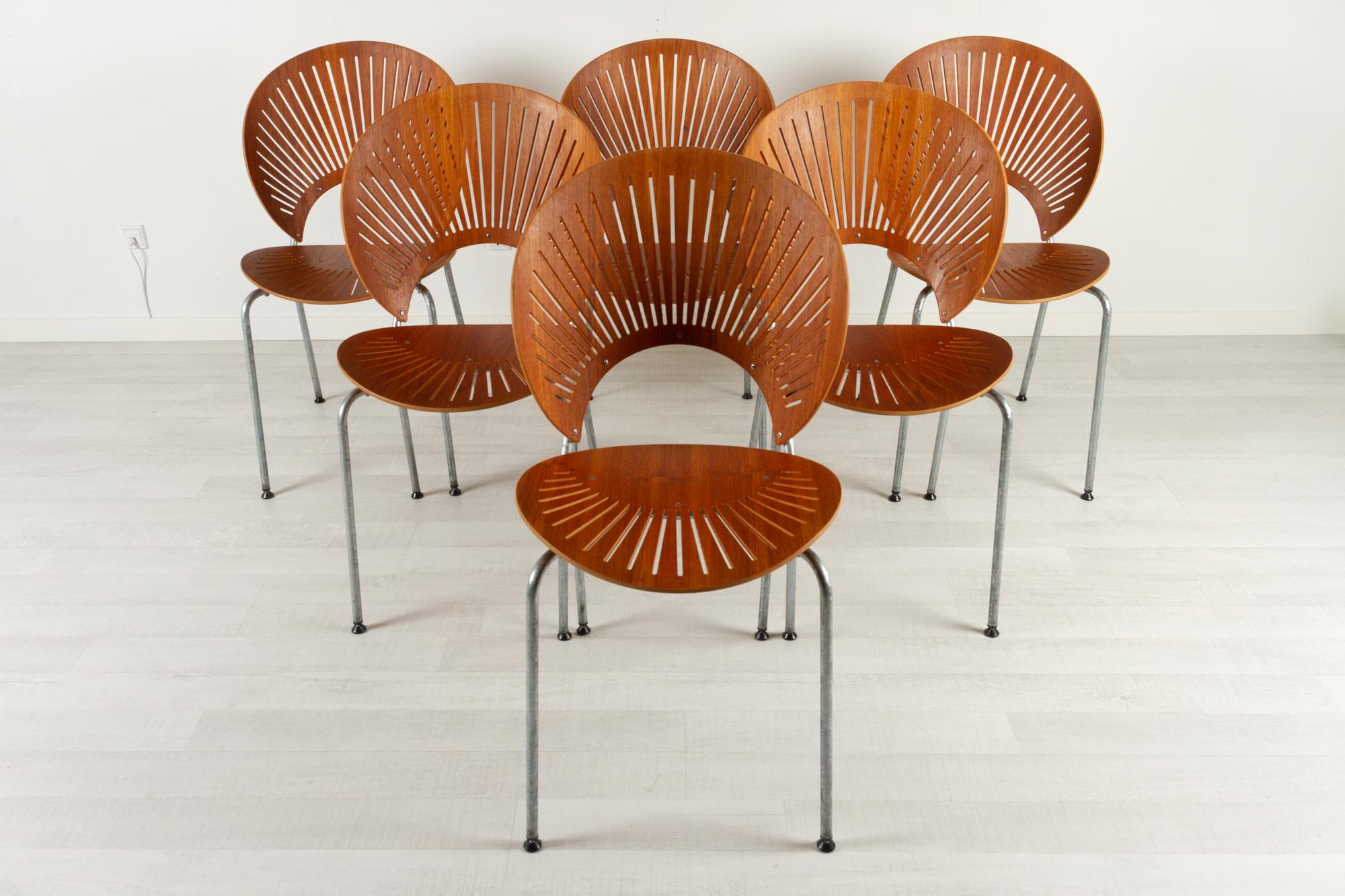 Trinidad teak dining chairs by Nanna Ditzel for Fredericia Stolefabrik Denmark 1990s

When designing the Trinidad Chair Model 3298 in 1993, Danish designer Nanna Ditzel found inspiration in the elaborate fretwork from the Gingerbread Facades that
