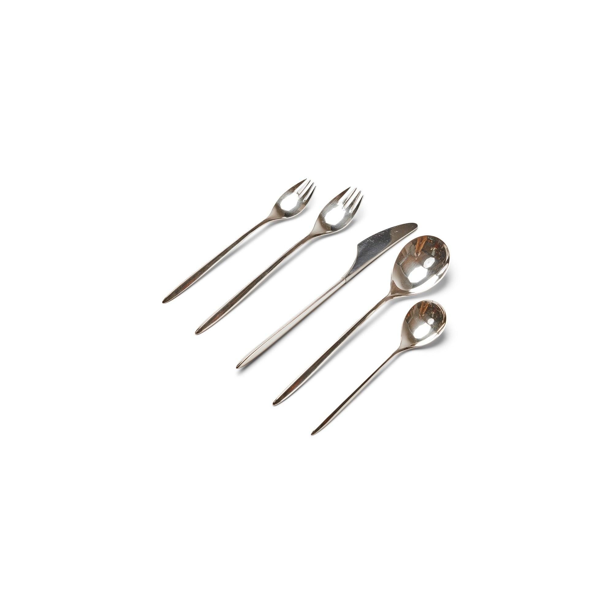 A service for one of 'Trinita' sterling flatware. Designed in 1960 to celebrate the 100 year anniversary of Cohr. Each stem having a flowing triangulated form. Place setting includes: dinner knife, dinner fork, salad fork, soup spoon and dessert