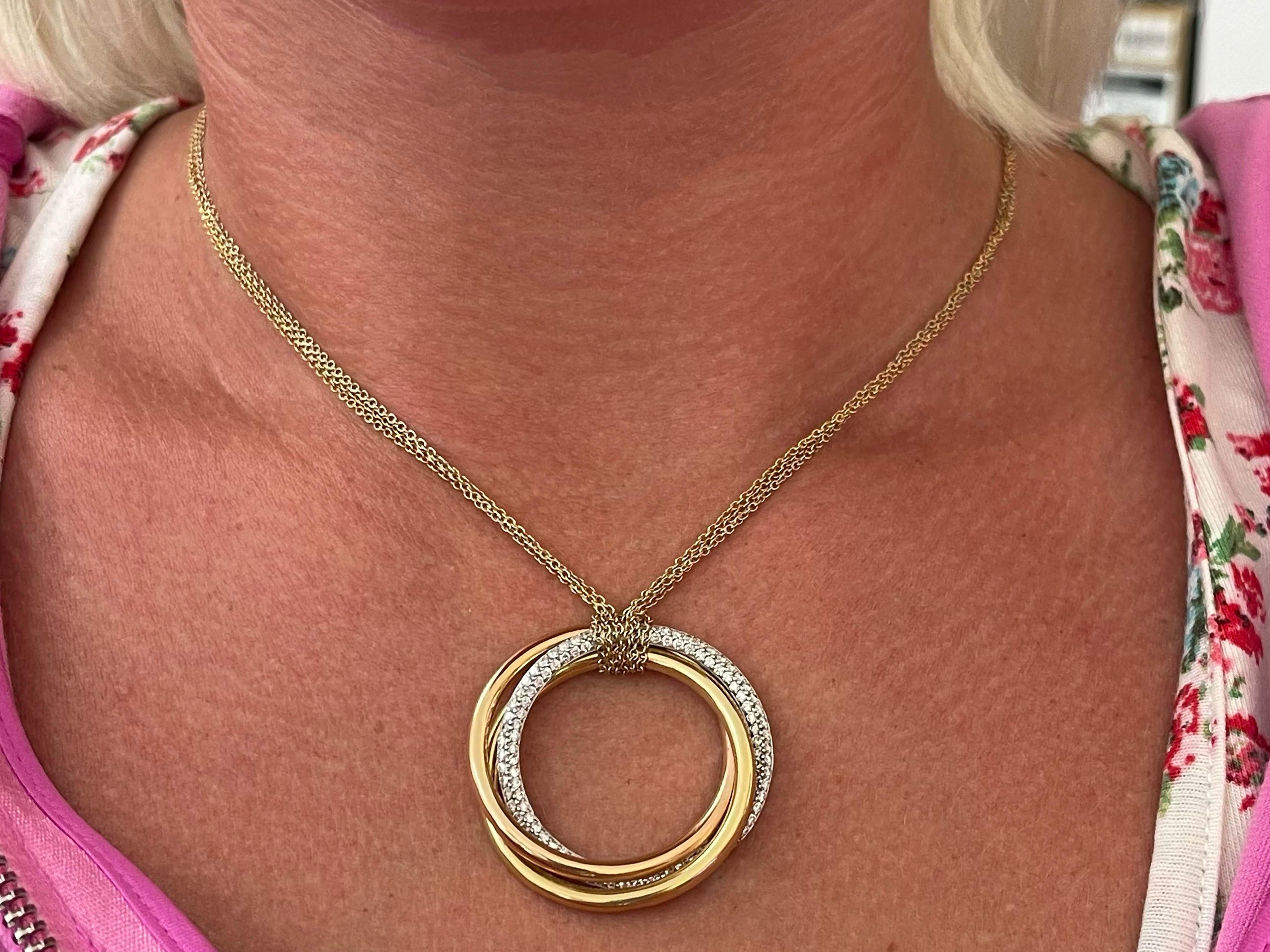 Trinity Diamond Necklace in 18k White Yellow & Rose Gold on Triple Strand Chain. The white gold ring is pave set with round brilliant-cut diamond totaling ~1.00 carats. The diamonds are G, VS. The rings measures 1.3