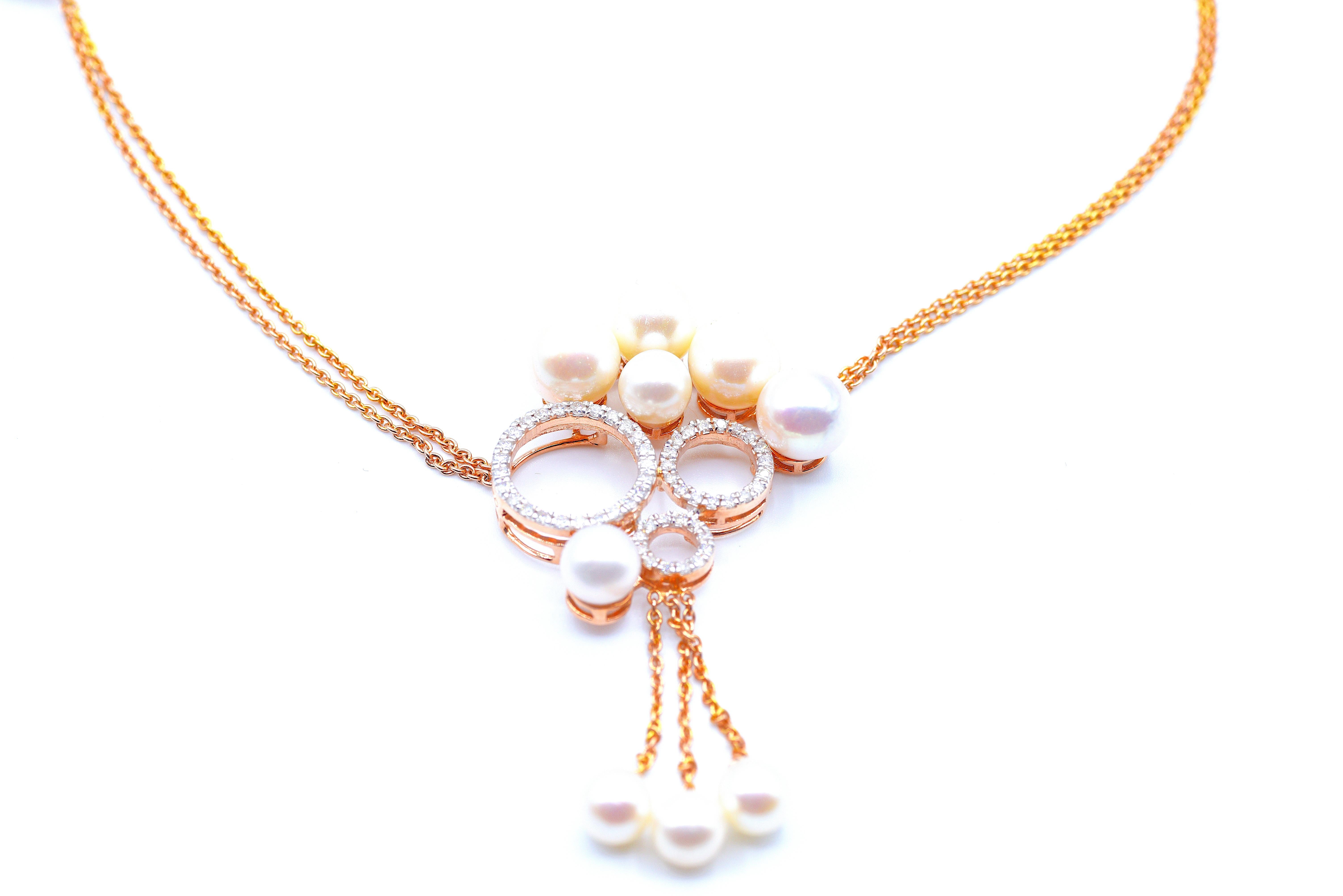 This exquisite diamond necklace in 18k rose gold features a trio of diamond circles embellished with dazzling diamonds and lustrous pearls. The cable chain is an 18k rose gold chain of length 16