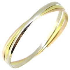 Trinity Three-Color Gold Rolling Bangle Bracelet by Cartier