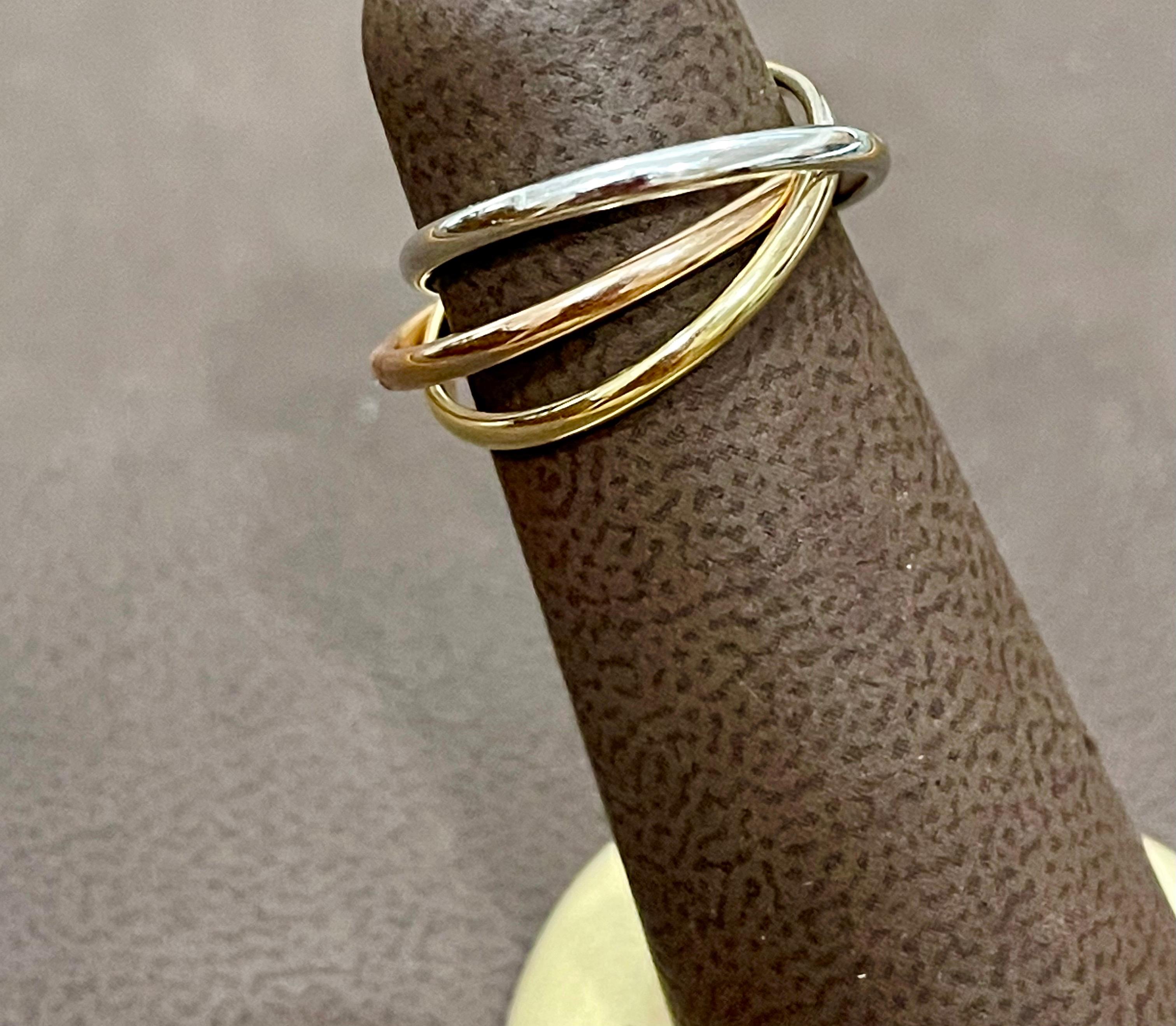 Trinity Tri-Color White, Yellow Gold & Rose, 14 Karat Gold Rolling Rings Italy

Ring Size	Size 6
Materials	14k Yellow Gold, White Gold and Rose Gold
Made in Italy
Measurements	Each ring is approx. 1.7 mm wide
Total Weight	  3.7 grams
Additional
