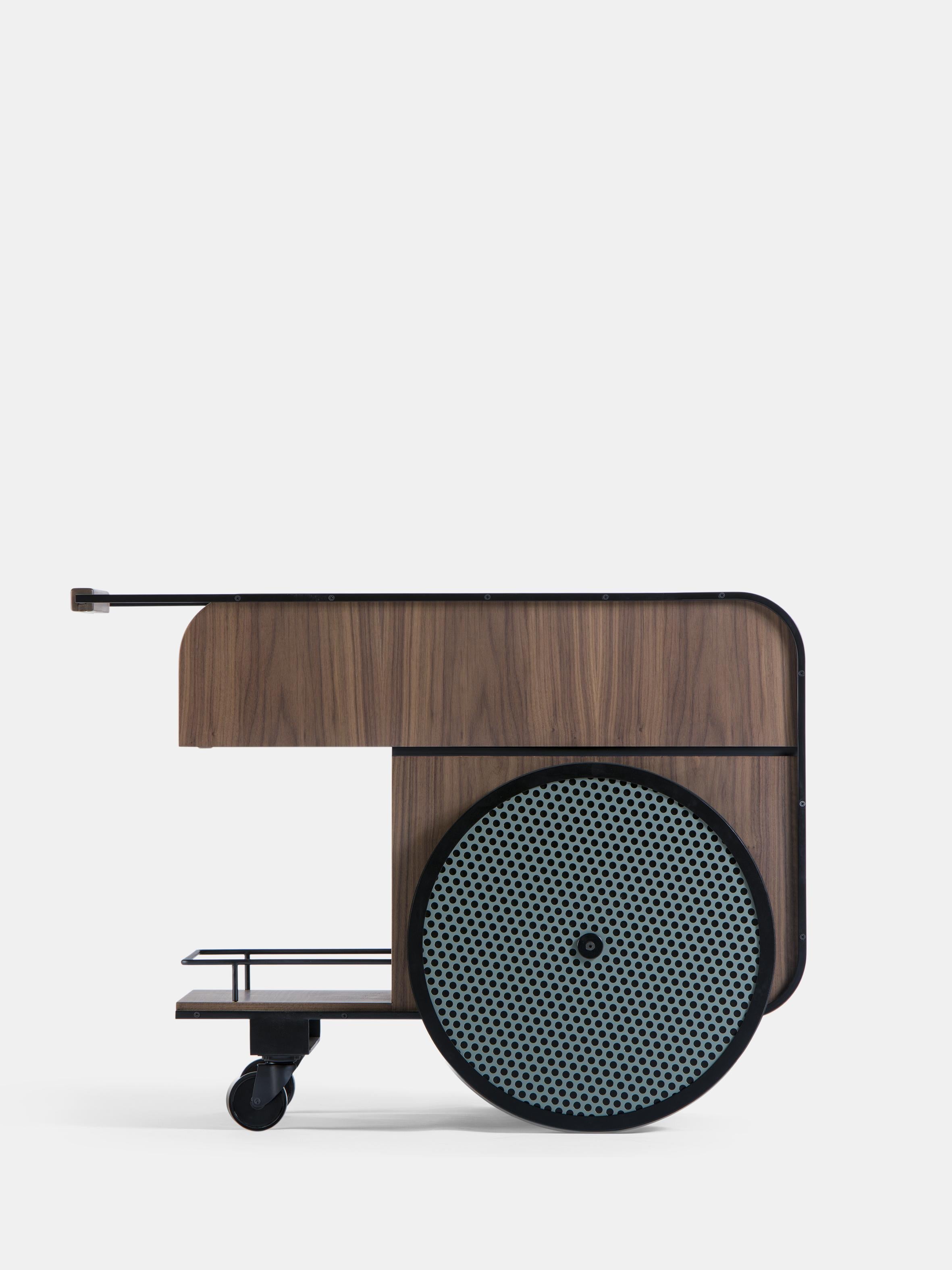 Trink Walnut Bar Cart by Kann Design
Dimensions: D 54 x W 100 x H 75 cm.
Materials: Steel frame, walnut solid wood, wood veneer, rubber wheel, aluminum.

With the Trink bar cart, the two designers Karl Chucri and Rami Boushdid of Studio Caramel