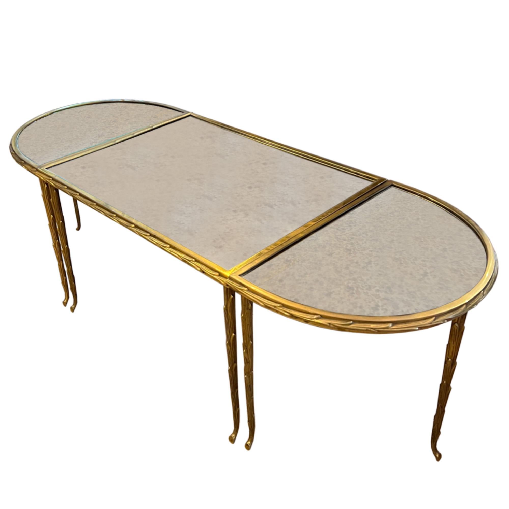 This beautiful trio of tables (attributed to Maison Baguès) date from the 1960s. You can keep them together, as we have pictured here for larger coffee table - or separate them out into three.

The legs have a slender palm design and gorgeous