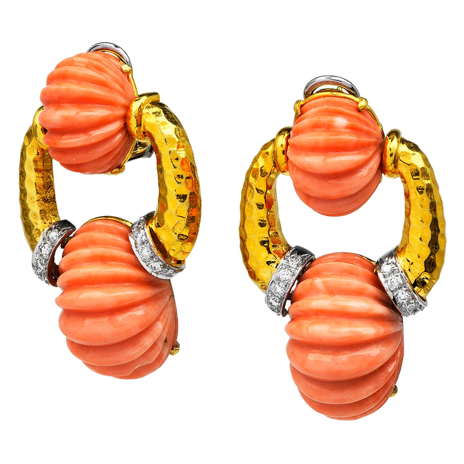 These exceptional hand-made vintage retro earrings, from the brand TRIO, are inspired in the Door-knocker style dangle hoop design.

Crafted in solid 18K yellow gold, enhnaced by 4 genuine carved natural salmon-colored coral, 24mm x 15 mm & 16 mm x