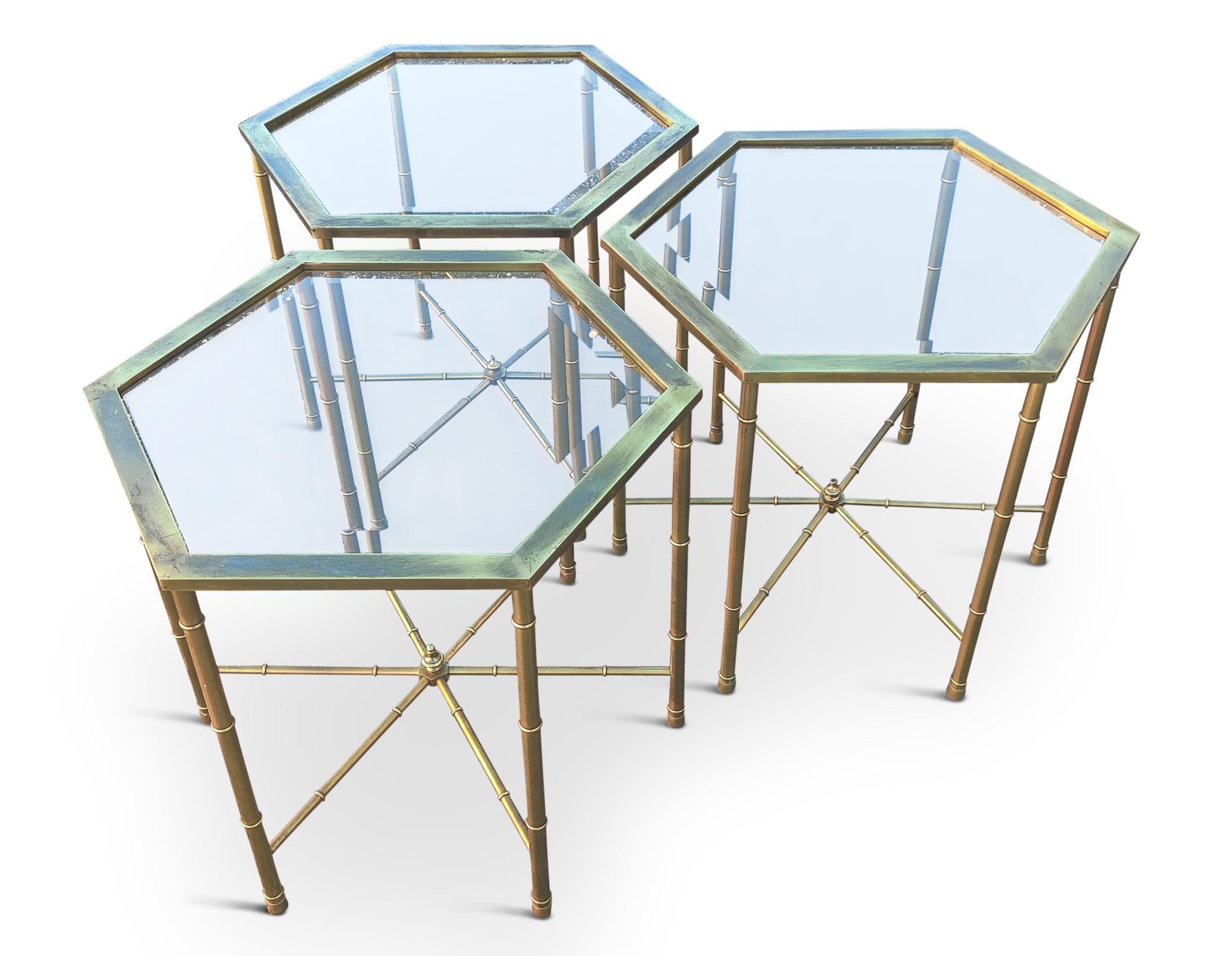 With a base of intricately manufactured brass tubing and precisly fitted beveled glass tops, these three hexagonal tables are a great addition to any modern home. The brass is consistent, bright, and feels very secure and well built. The glass tops