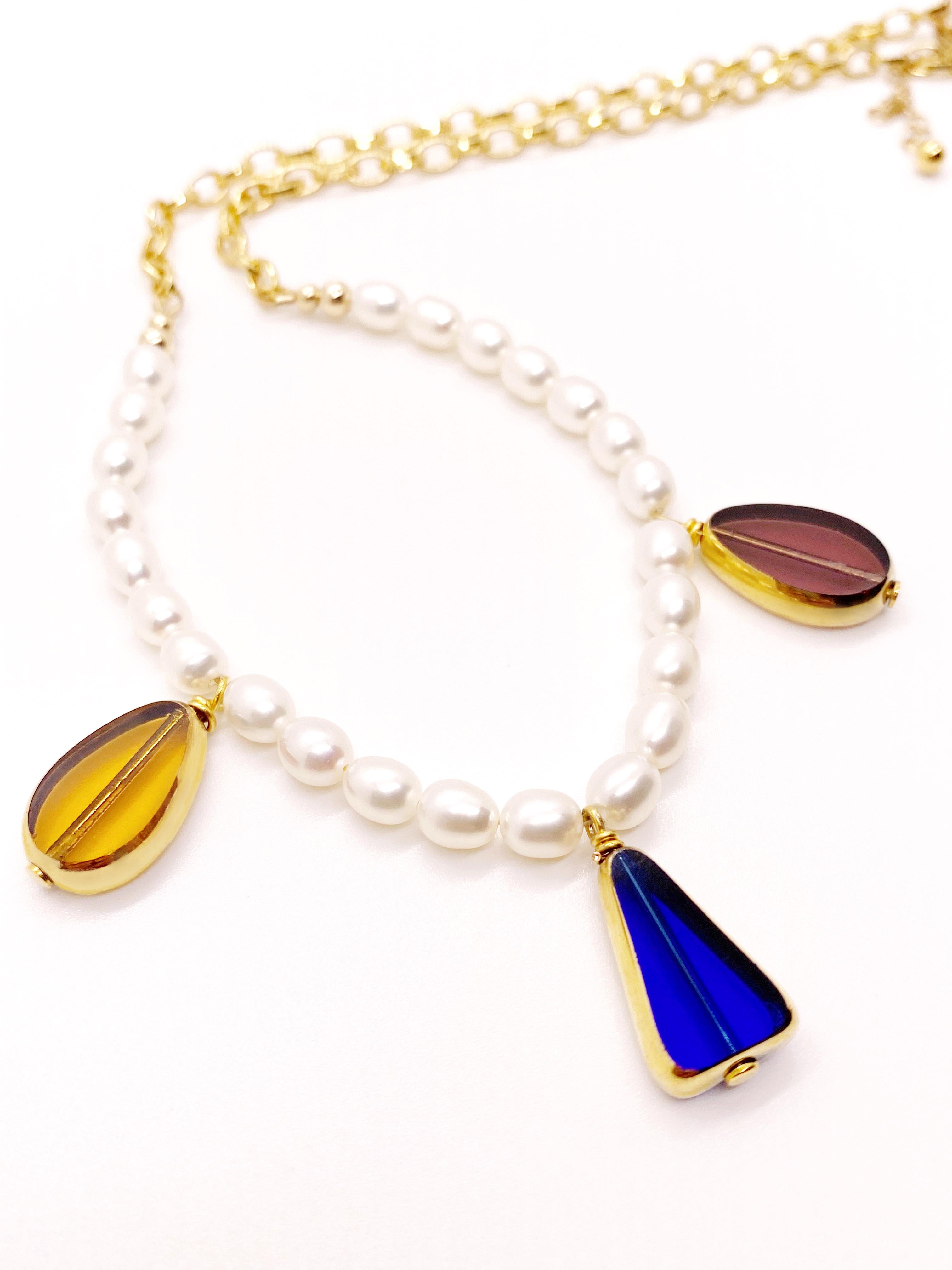 Freshwater pearls with 18K gold filled chain adorned with 3 vintage German glass beads trimmed with 24K gold. It is finished with 14K gold filled clasp and metals. This necklace is 18 inches long and can be extended up to 20 inches.

The 24K vintage