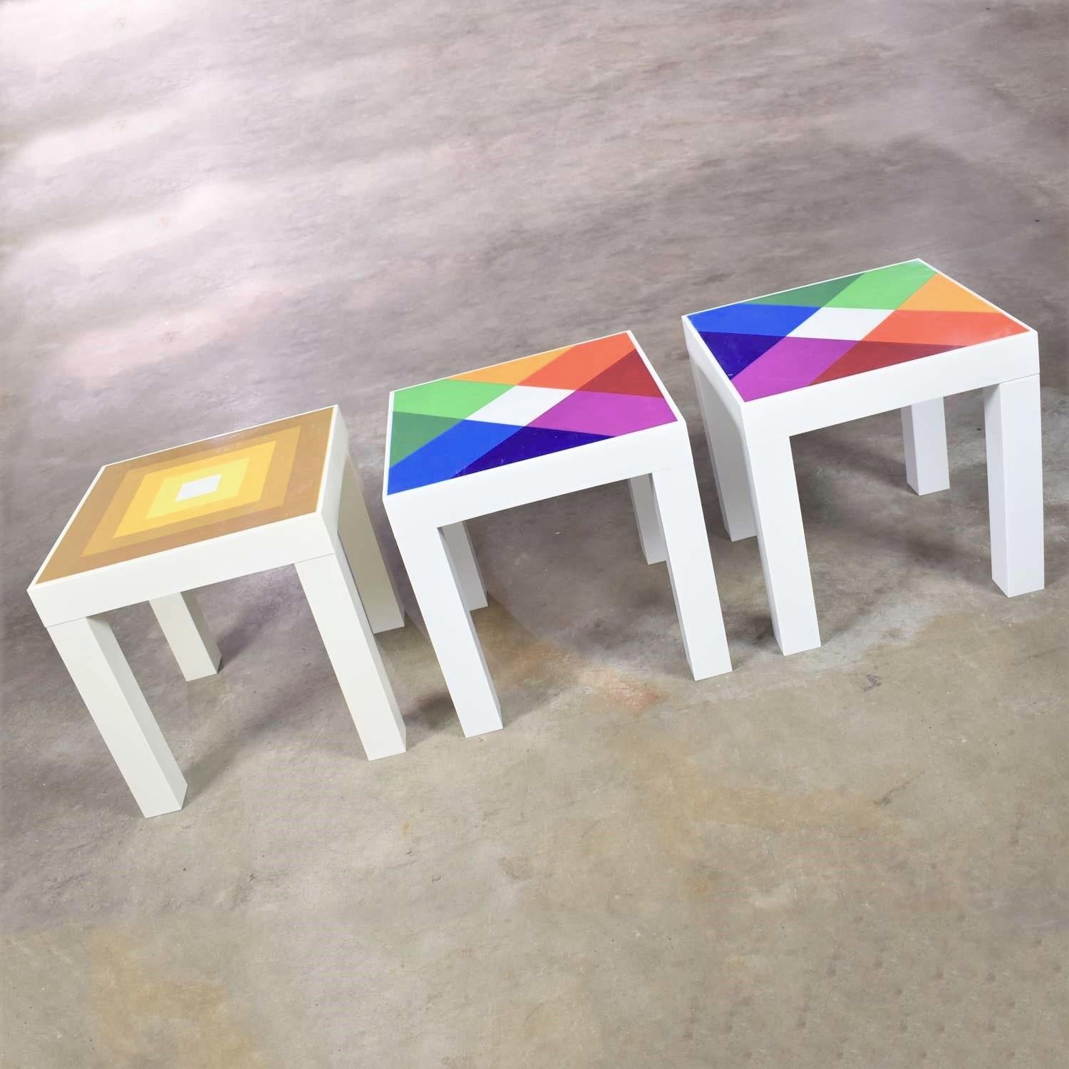 Amazing trio of mod pop art plastic parsons style square side tables in the style of Kartell or Syroco. With one table design in the style of Josef Albers. They are in wonderful vintage condition but not without signs of age including some fading