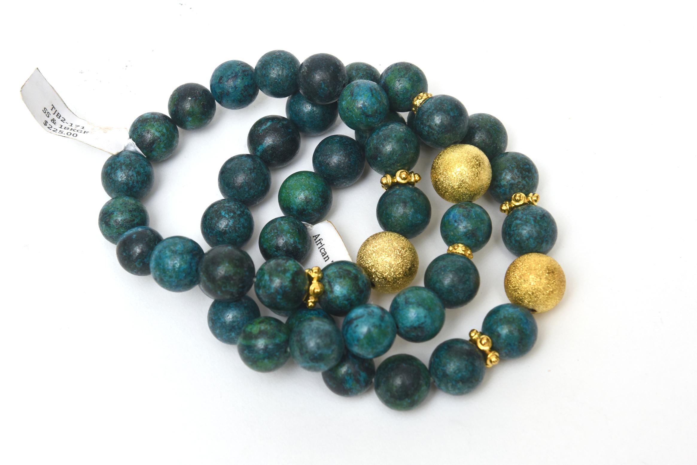 These never worn set of 3 African turquoise beaded bracelets with interspersed gold filled fragments are stretch bracelets with elastic. These were once in a boutique shop on a 5 star cruise but were never sold. They have their original tags on them