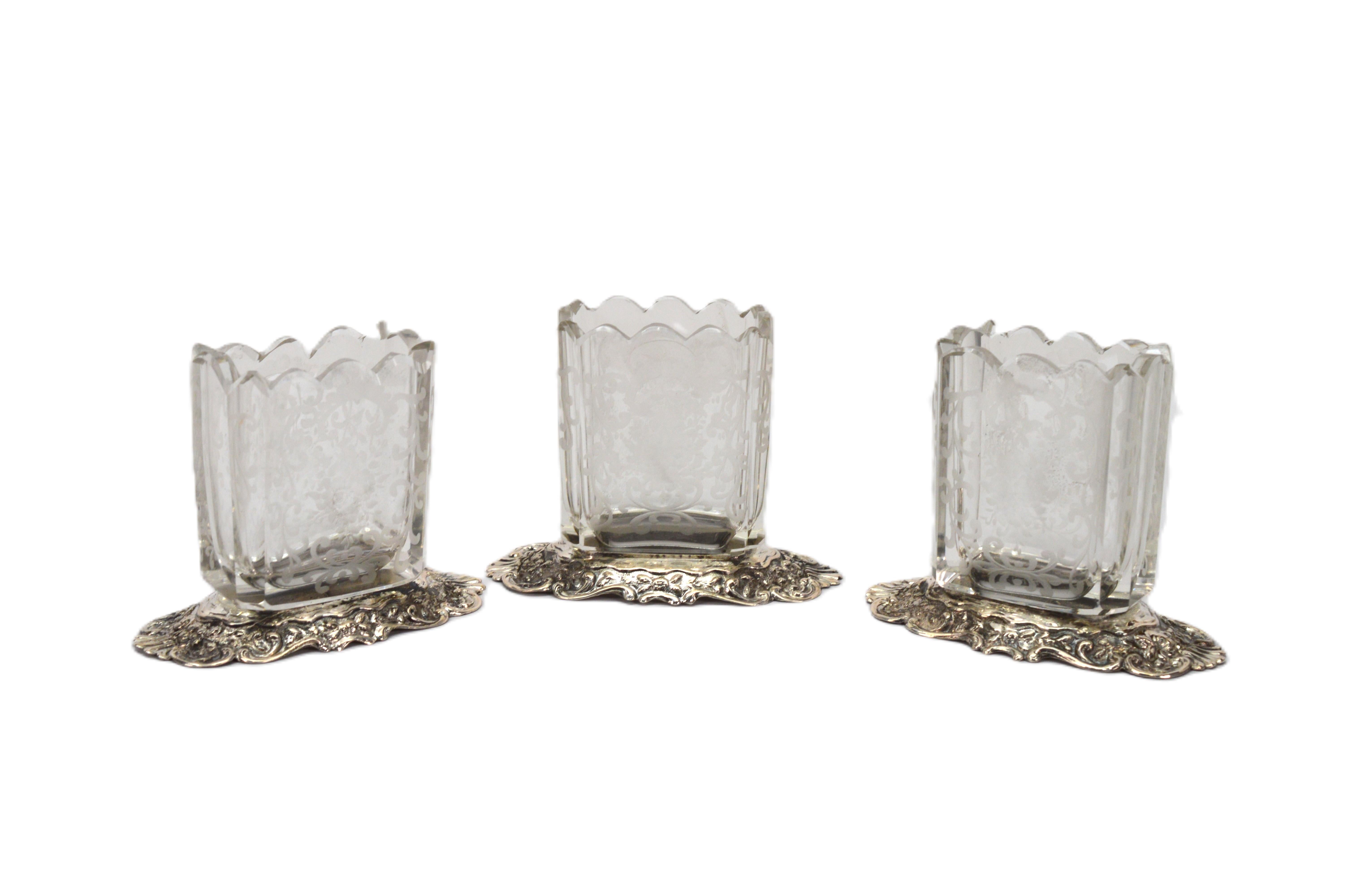 Enjoy this stunning three piece set of German-made antique etched glass and silver repousse vessels as a beautiful addition your vanity set or as table top decor.  Together or separately, the uses are endless to elegantly contain and display small