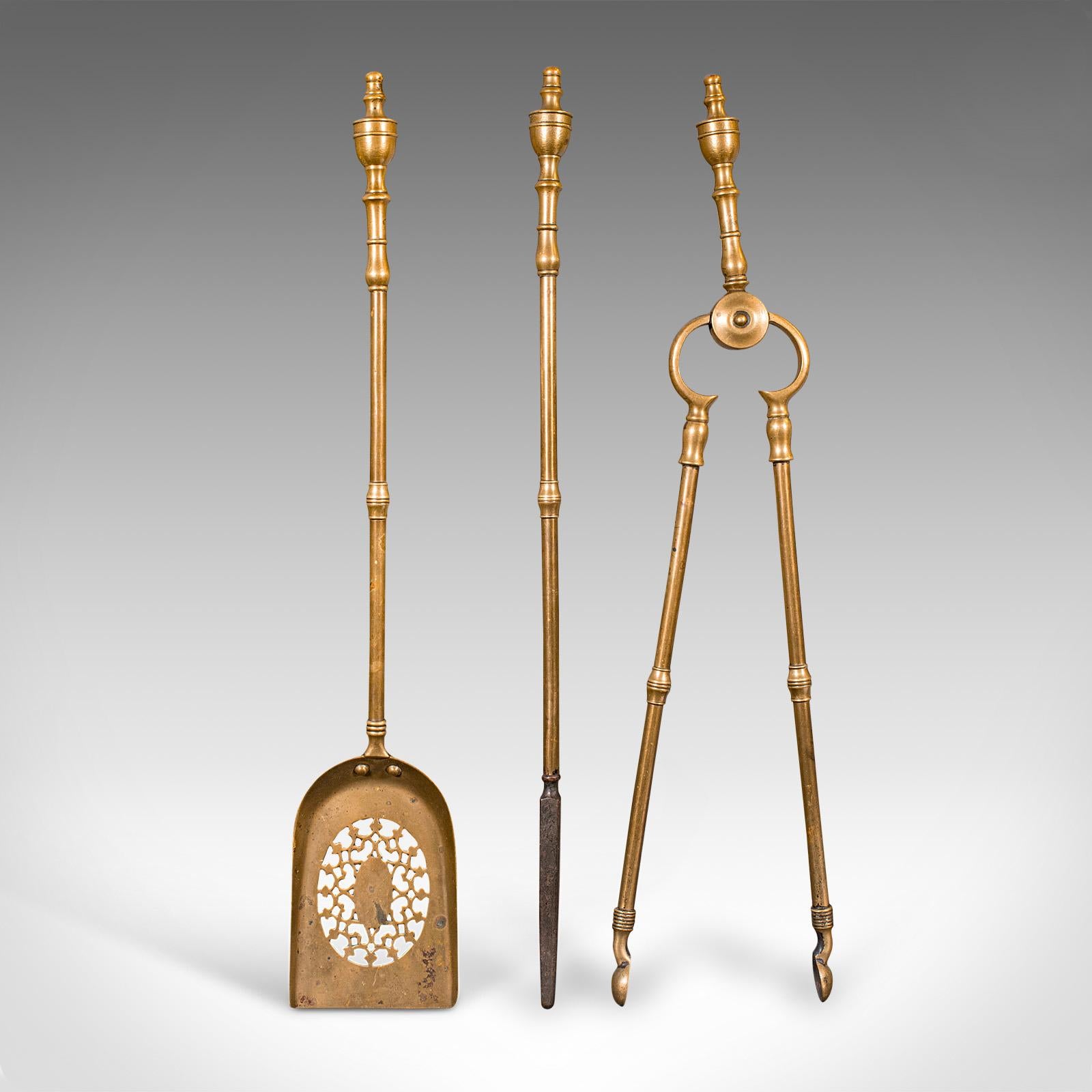 
This is a trio of antique fire tools. An English, brass fireside companion set, dating to the early Victorian period, circa 1850.

Appealing Early Victorian set, with three pleasingly weighted tools
Displaying a desirable aged patina and in good