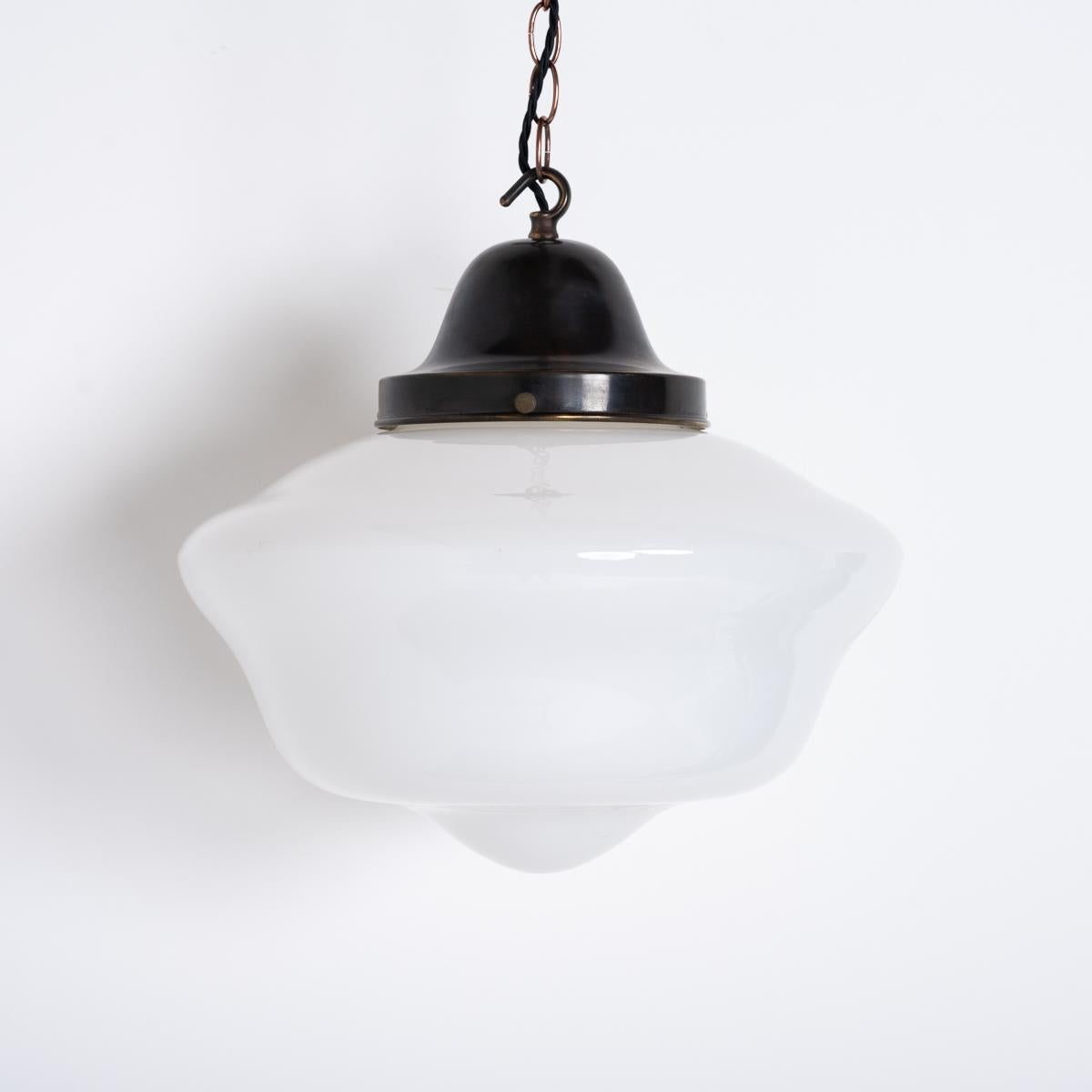 A STUNNING TRIO OF LARGE SCHOOLHOUSE OPALINE PENDANTS
SOLD AS A SET OF THREE

Reclaimed from a social club in the North East of England.

Beautiful shaped opaline glass with original aged brass galleries completely original and finished with beeswax