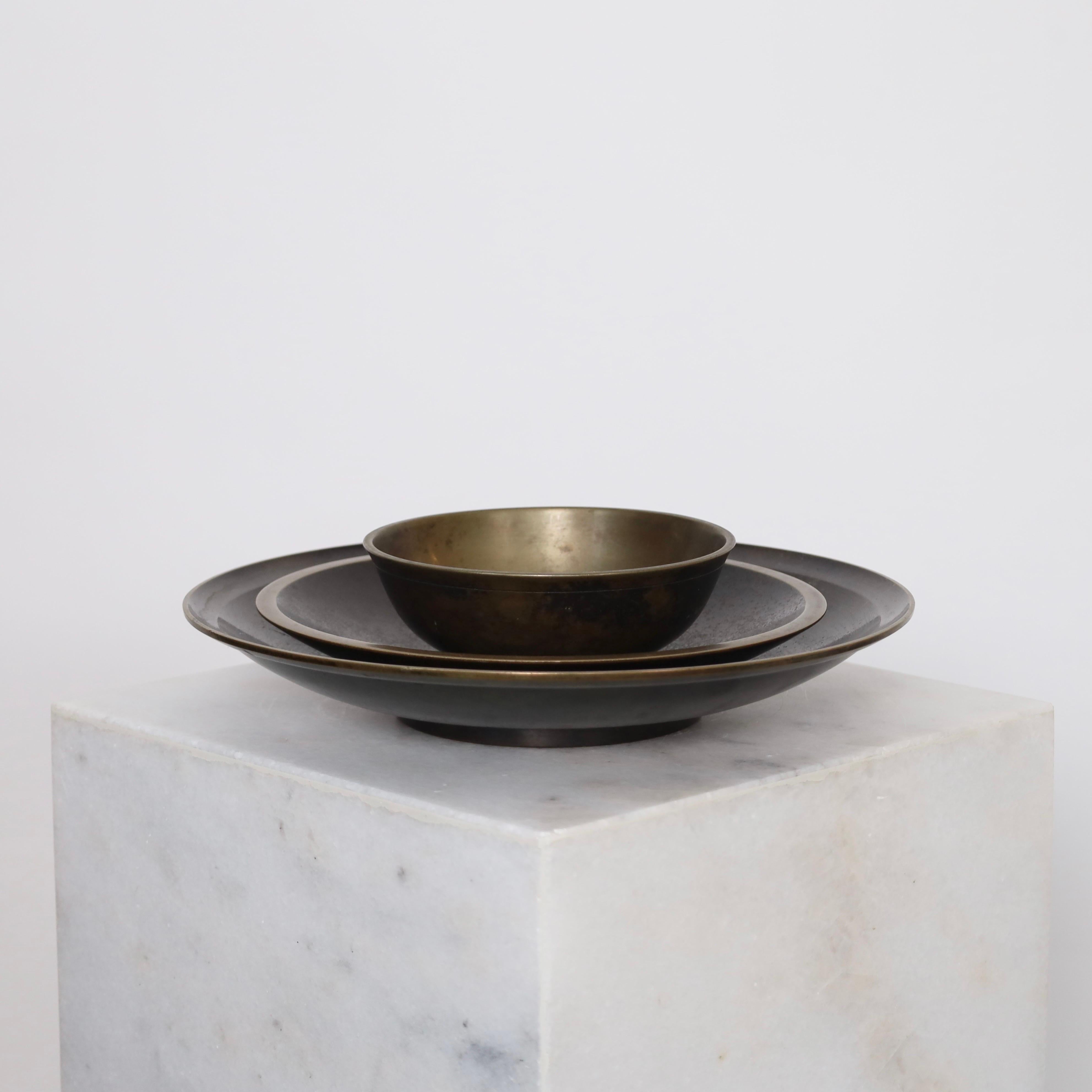 Bronze Bowls designed by Just Andersen in the early 1930s. An exquisite trio for beautiful place.

* Set of three bronze bowls 
* Designer: Just Andersen
* Style: B208, B2011 & B1893
* Year: 1925-1930 & 1937
* Condition: Good vintage condition.