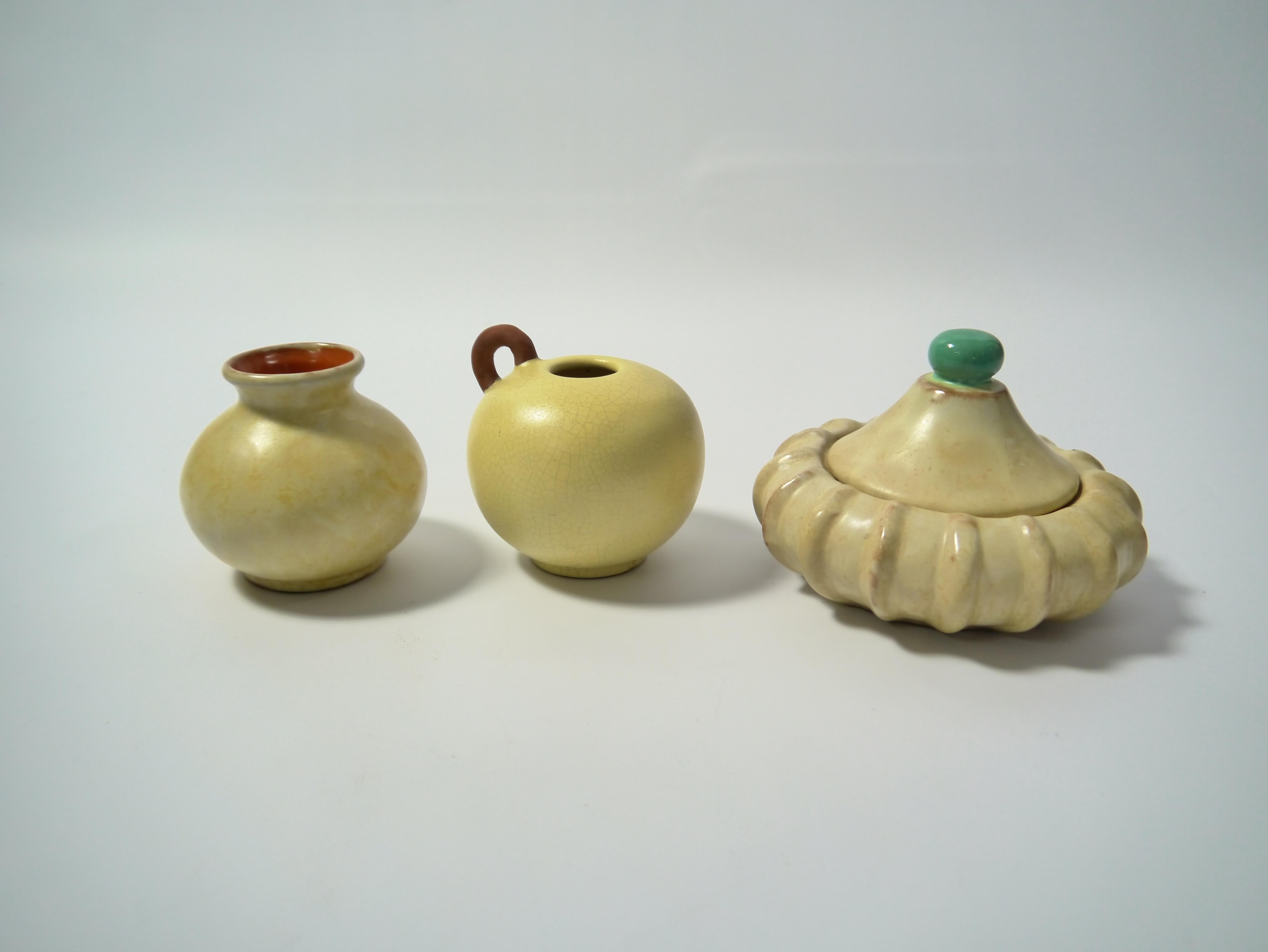 Three glazed Art Deco ceramic vessels made by Upsala Ekeby (established 1886). Decorative and beautiful vanilla colored crackled glaze. All vessels marked EKEBY.