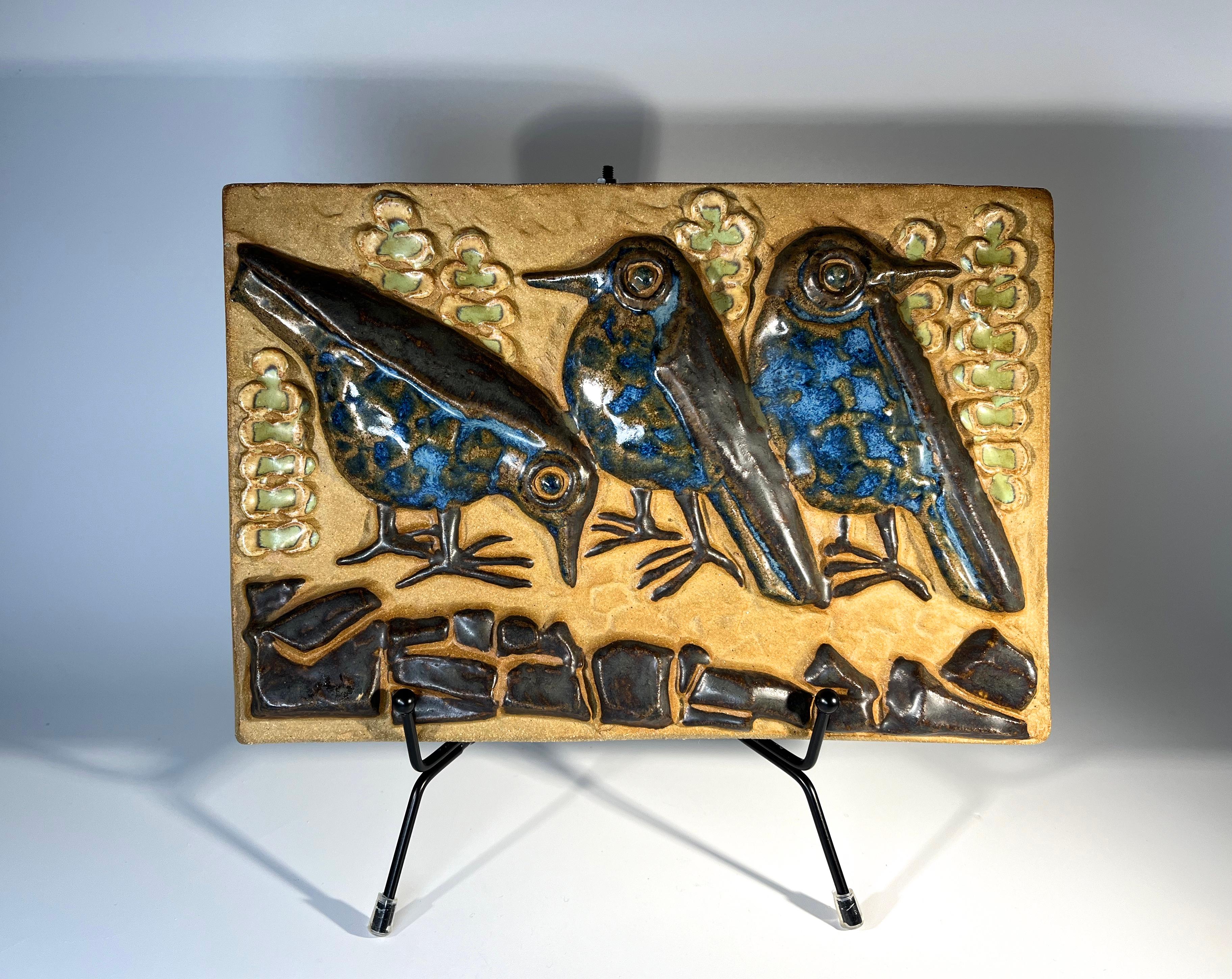 Trio of birds wall plaque, by Marianne Starck for Michael Andersen, Denmark 
Amusing trio glazed with blue, green and brown over stoneware
Stamped MS, Three Herrings mark and #6267 on reverse
Width 9.5 inch, Height 6.5 inch, Depth 1 inch
Weight 3lb