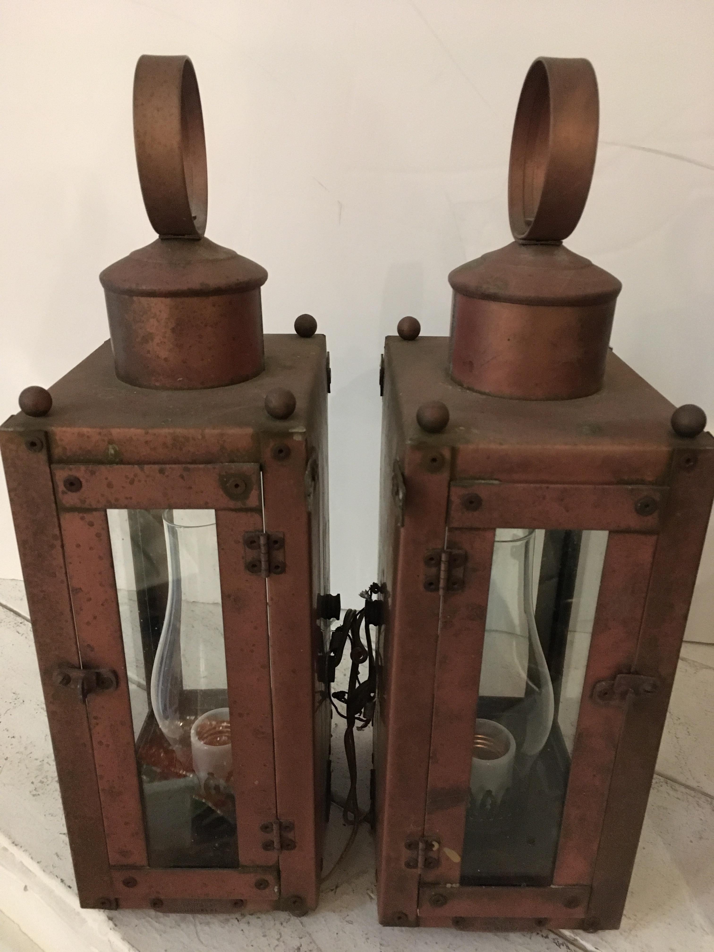 Handcrafted by Hollis Fisher, lamplighter corner, Martha's Vineyard, a handsome trio of brass and copper exterior lantern sconces.
2 square lanterns are 16 tall x 6.25 wide x 4.75 deep
the other one is 16 x 8 x 7.5 deep.