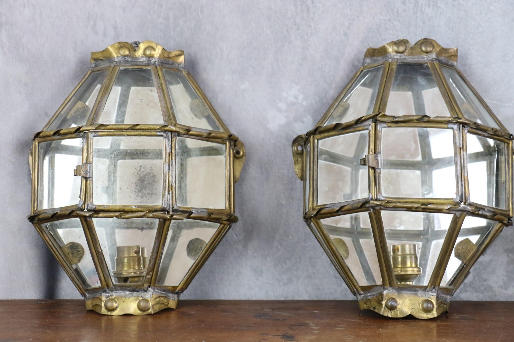 Trio of Brass and Glass Vintage Handcrafted Lantern Wall Lamps, 1940s, France

Beautiful minimal and geometric design highlighted by sophisticated details like the mirror in the back of the reflector and the twisted brass. These beautiful sconces