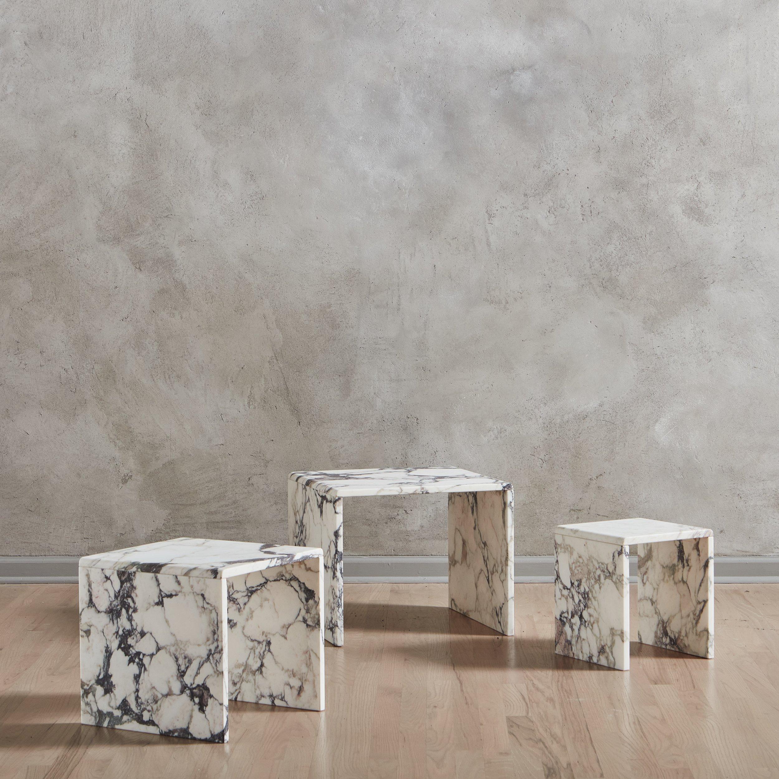 A trio of 1970s Italian tables constructed with beautifully veined Calacatta Viola marble in a range of white, gray and taupe hues. These honed tables feature sleek profiles and nest together, making them versatile for a range of spaces. Unmarked.