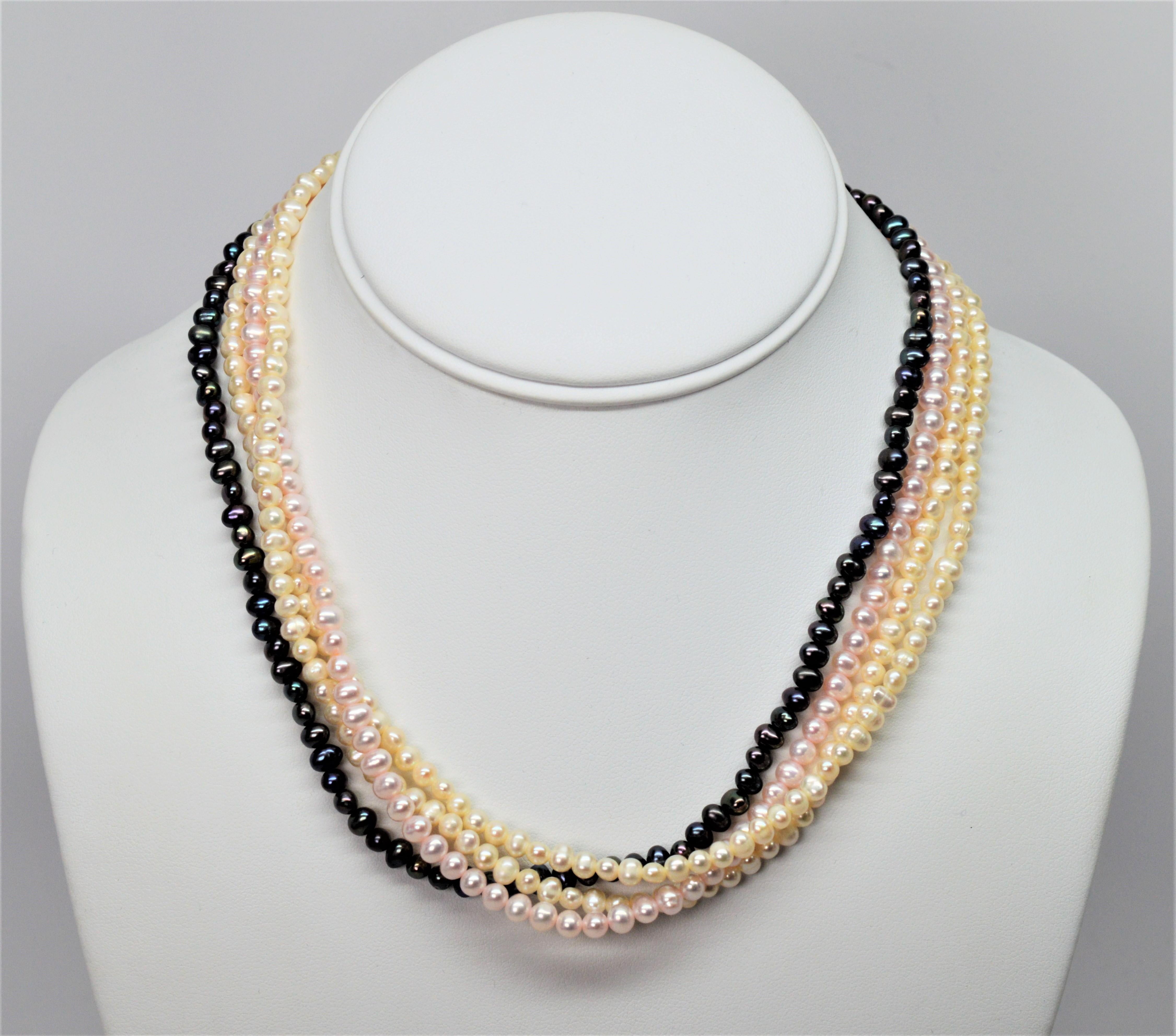Classic creamy white, soft blush pink and hues of gray iridescent Akoya pearl strands create a lovely pearl necklace which can be worn as a drape or colorful twist.  Sixteen inches 16