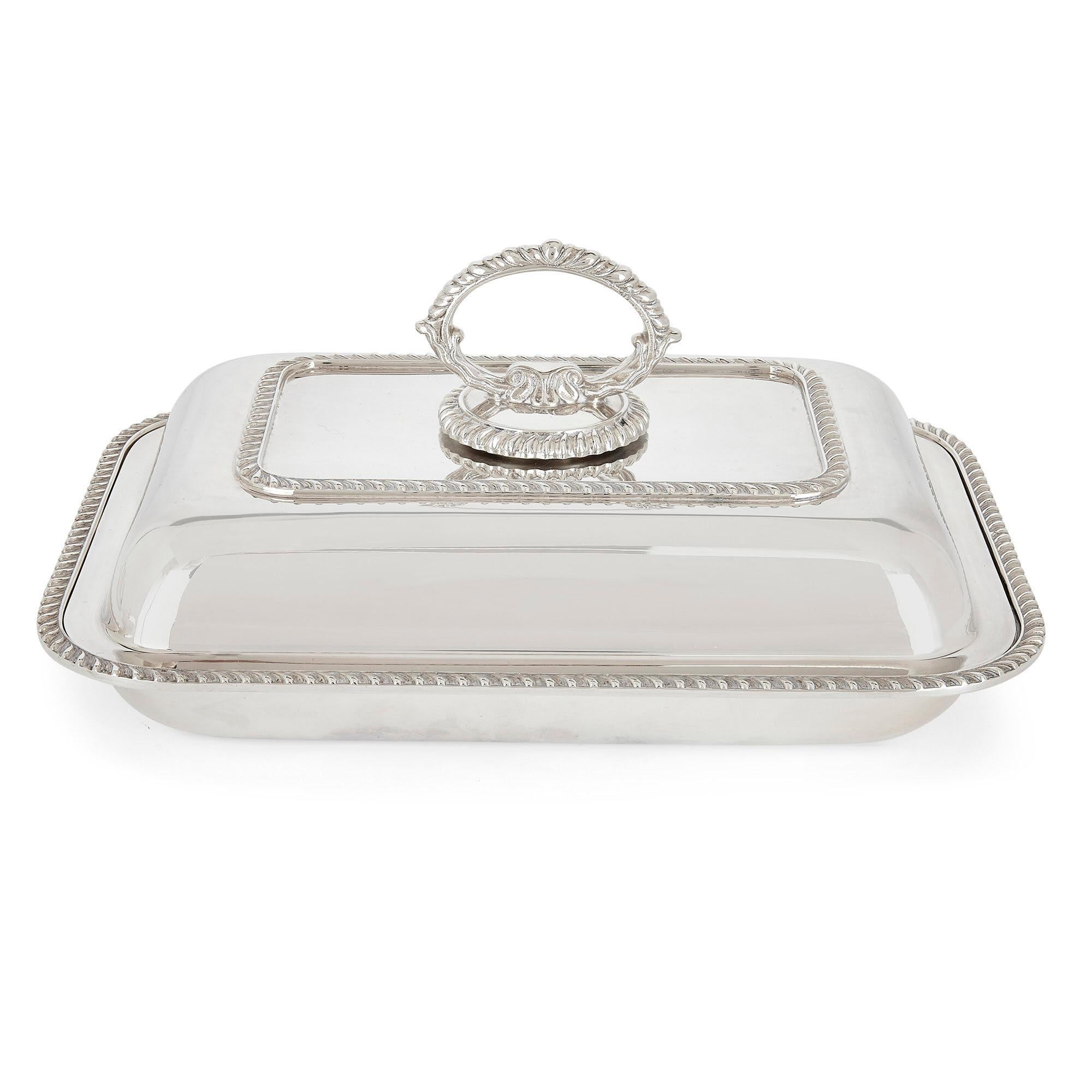 Trio of fine Mappin & Webb silver-plate dishes and covers
English, 20th Century
Dimensions: Height 13cm, width 28cm, depth 20cm

Consisting of three entrée dishes with covers, this set is crafted from silver-plate. Each dish features a moulded