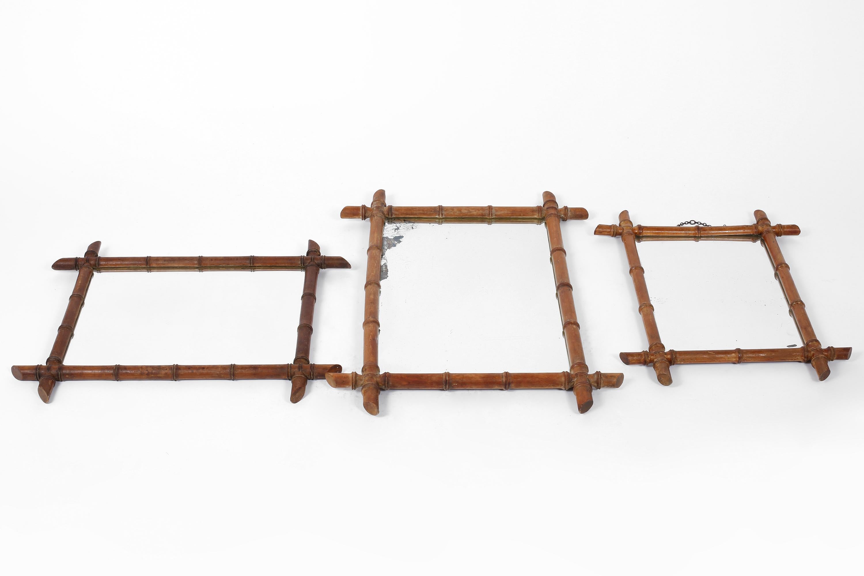 A trio of early 20th century carved wood mirrors with stylised faux bamboo frames and nice foxing to two of the plates. French, c. 1900.

Left: W65 x H53.5 cm

Centre: W57 x H78 cm

Right: W47 x H61.5 cm.