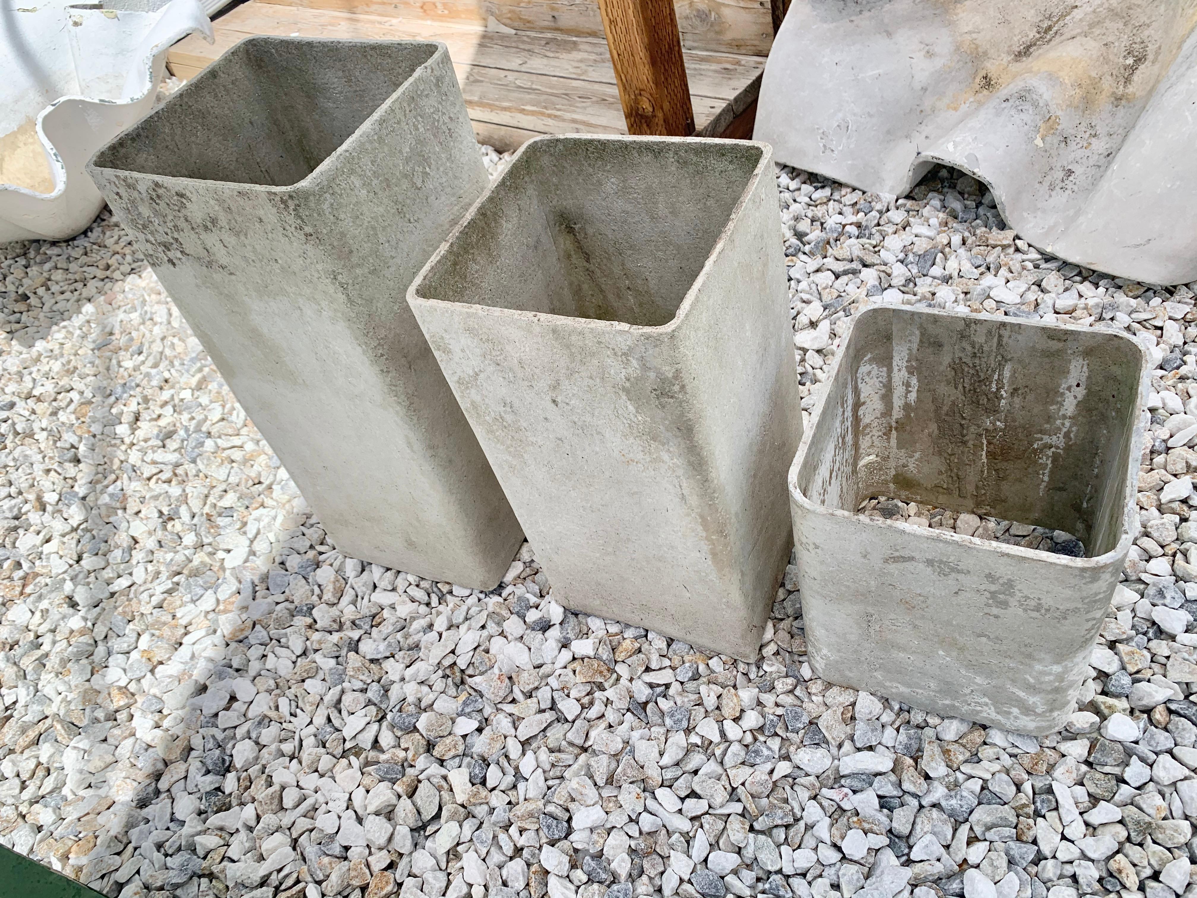 Unique set of three concrete planters by Swiss architect Willy Guhl. Rectangular planters with hollow bottom. Perfect for planting directly into the ground. Could also be used to hide unsightly pipes or hoses outside. Super functional piece of Willy