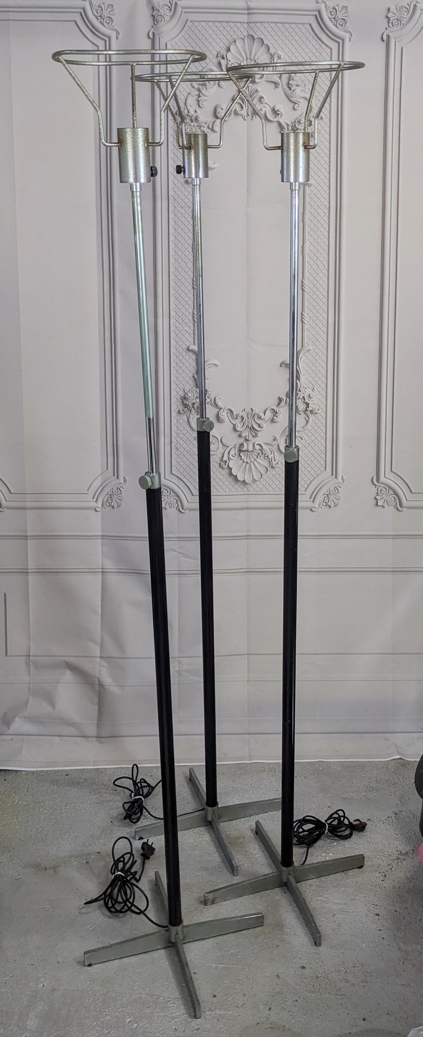 Unusual Trio of Art Deco Adjustable Floor Lamps with black enameled metal shafts and silvered metal. They extend to different heights for interesting options. 1930's USA.  Black enamel metal shafts 1.25