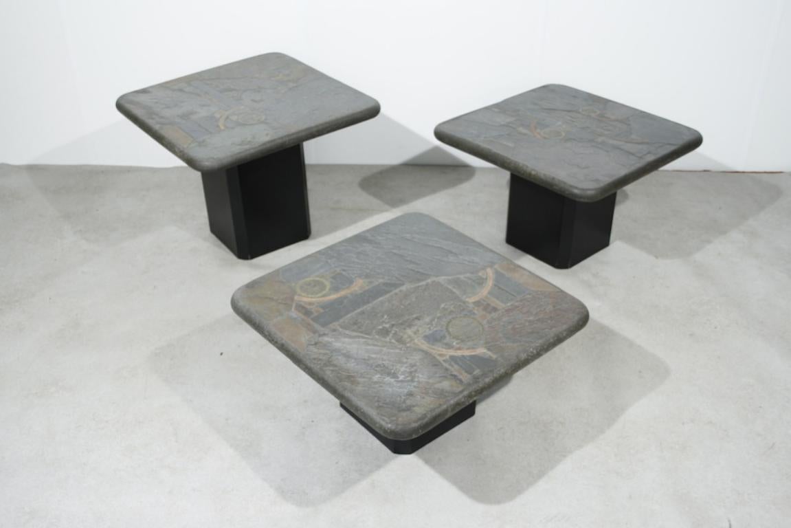 Trio of Marcus Kingma stone coffee tables, Dutch design, 1970s.

Matching trio of heavy stone top coffee tables on a wooden base. Signed by M. Kingma, the son of Paul Kingma. The tables come with an certificate.

They consist of three