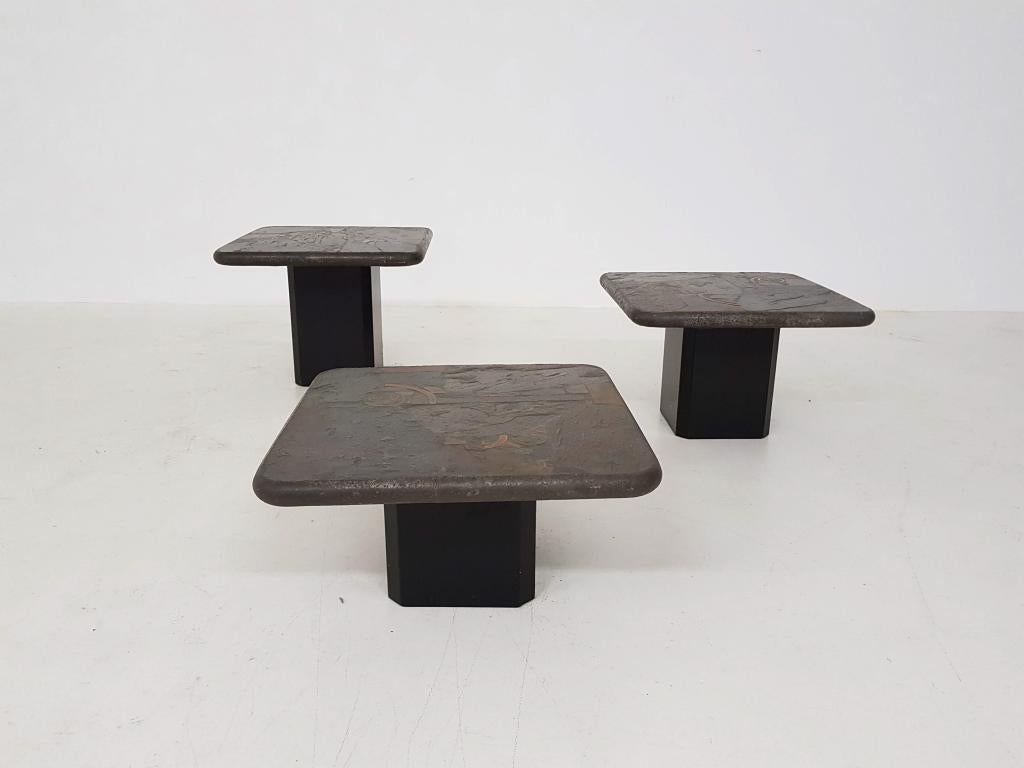 Trio of Marcus Kingma stone coffee tables, Dutch design, 1970s.

Matching trio of heavy stone top coffee tables on a wooden base. Signed by M. Kingma, the son of Paul Kingma. The tables come with an certificate.

They consist of three