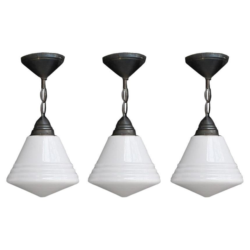 Trio of Mid 20th Century Glass Phillips Pendants Lights