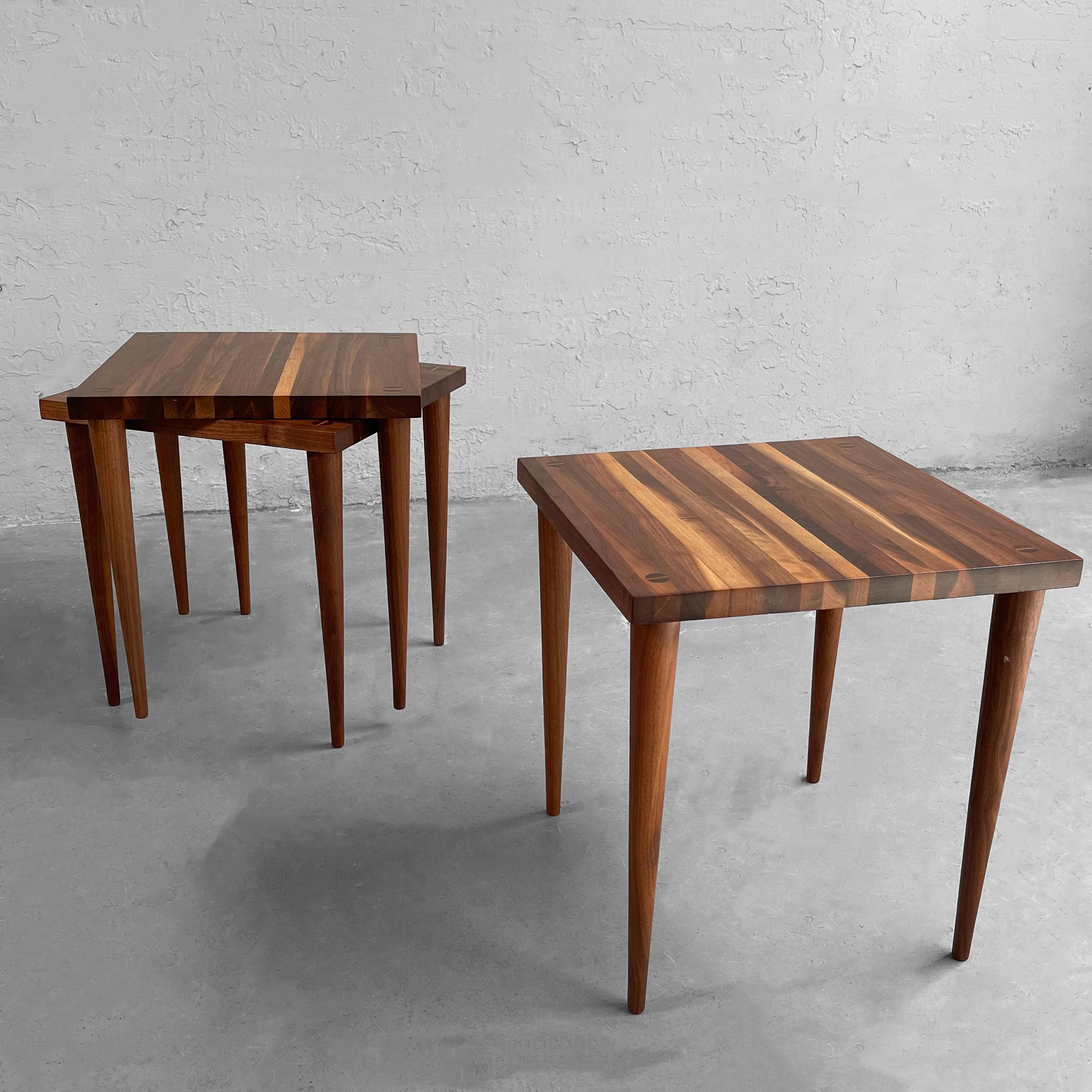 Trio of petite, Mid-Century Modern, walnut block, tapered leg, stacking tables by Mel Smilow for Smilow-Thielle can be stacked together, used as occasional side tables or continuously as a coffee table.