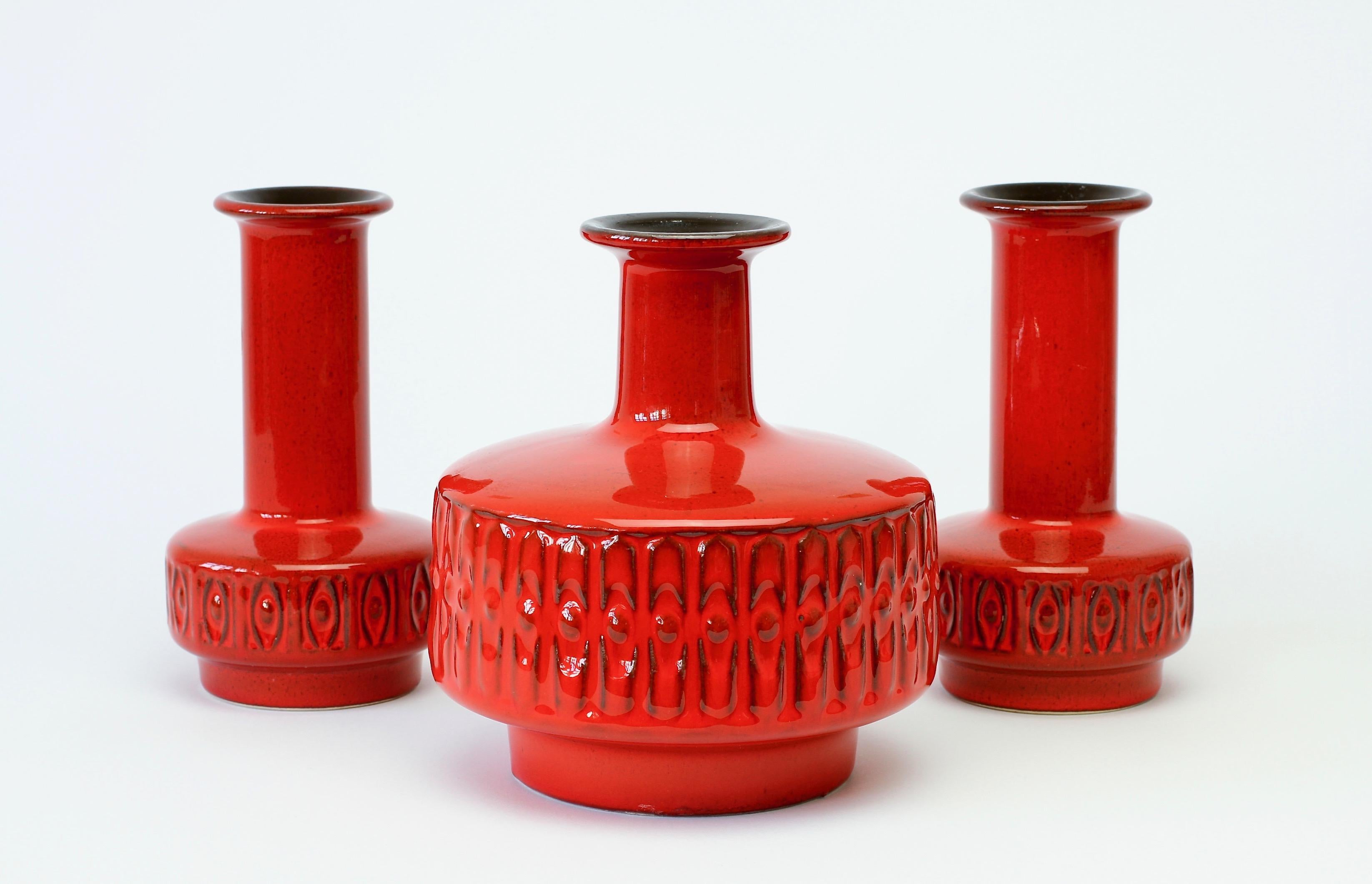 Trio of small vases by Fohr Pottery, Germany, circa 1970. The Company Fohr started producing decorative pottery in the 1950s under Wilhelm Fohr, although they were originally founded in 1859 by Peter Fohr. The vase with it's delightful form, bright