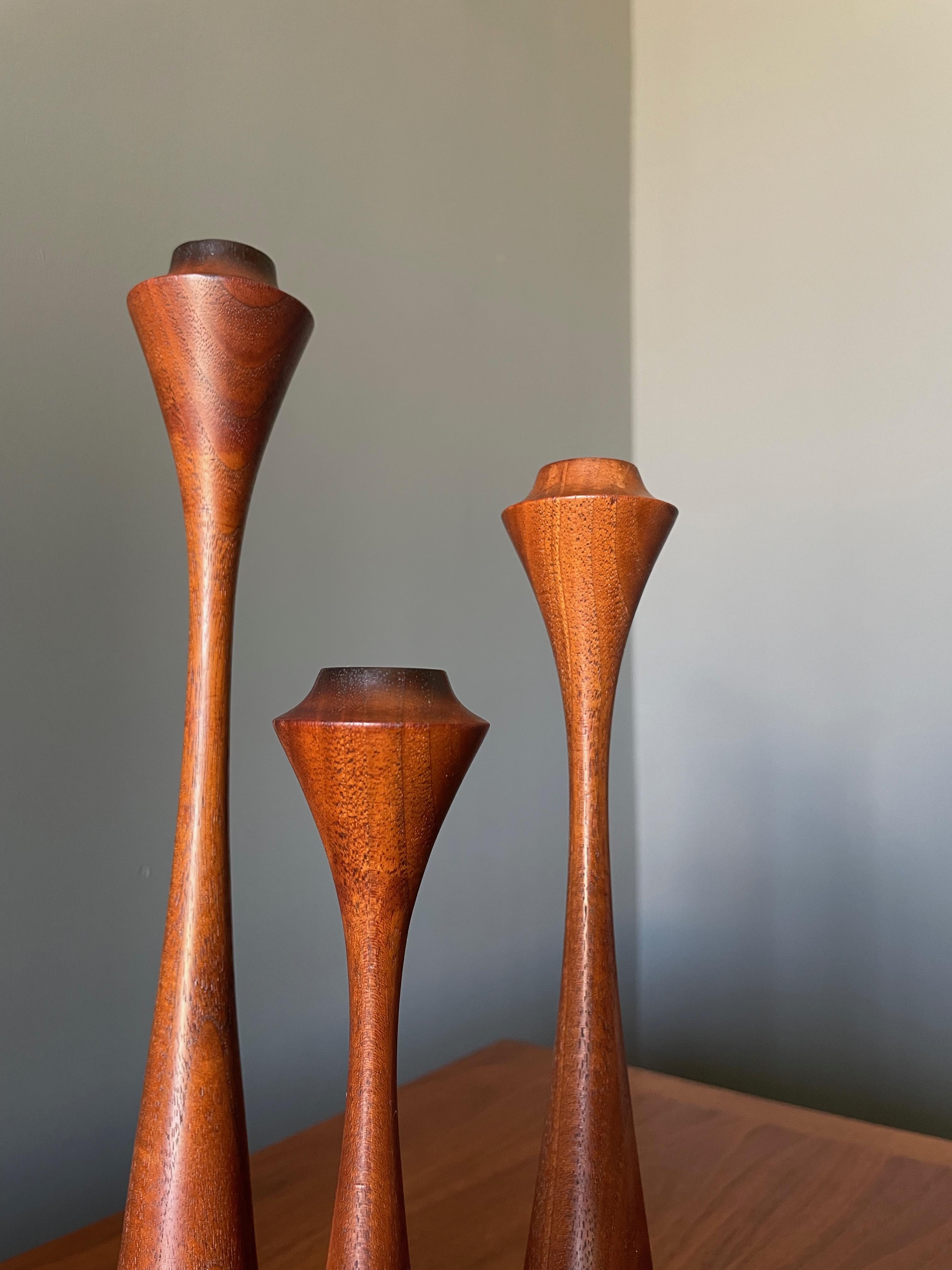 Trio of mid century candle holders. Beautiful sculpted design and graduated sizes, from 12