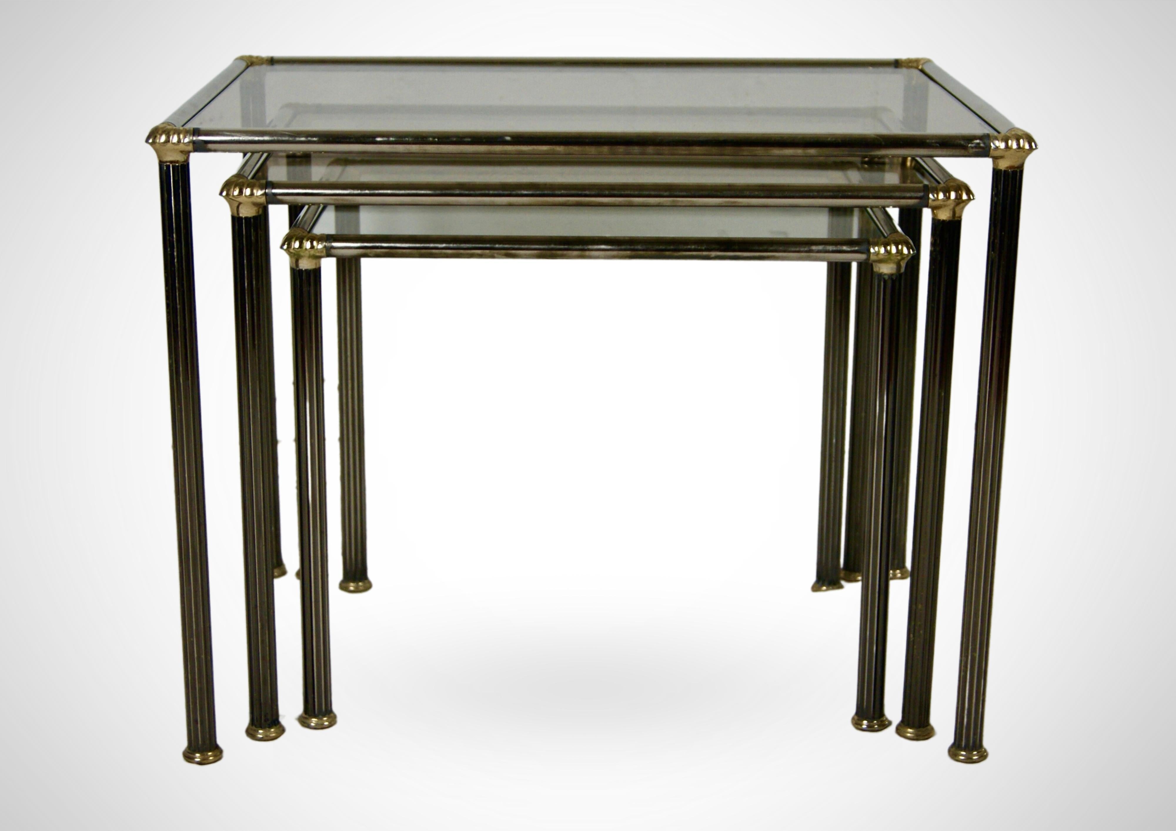 Stainless Steel Trio of Nesting Tables With Smoked Glass Tops Circa 1970s Maison Charles Style  For Sale